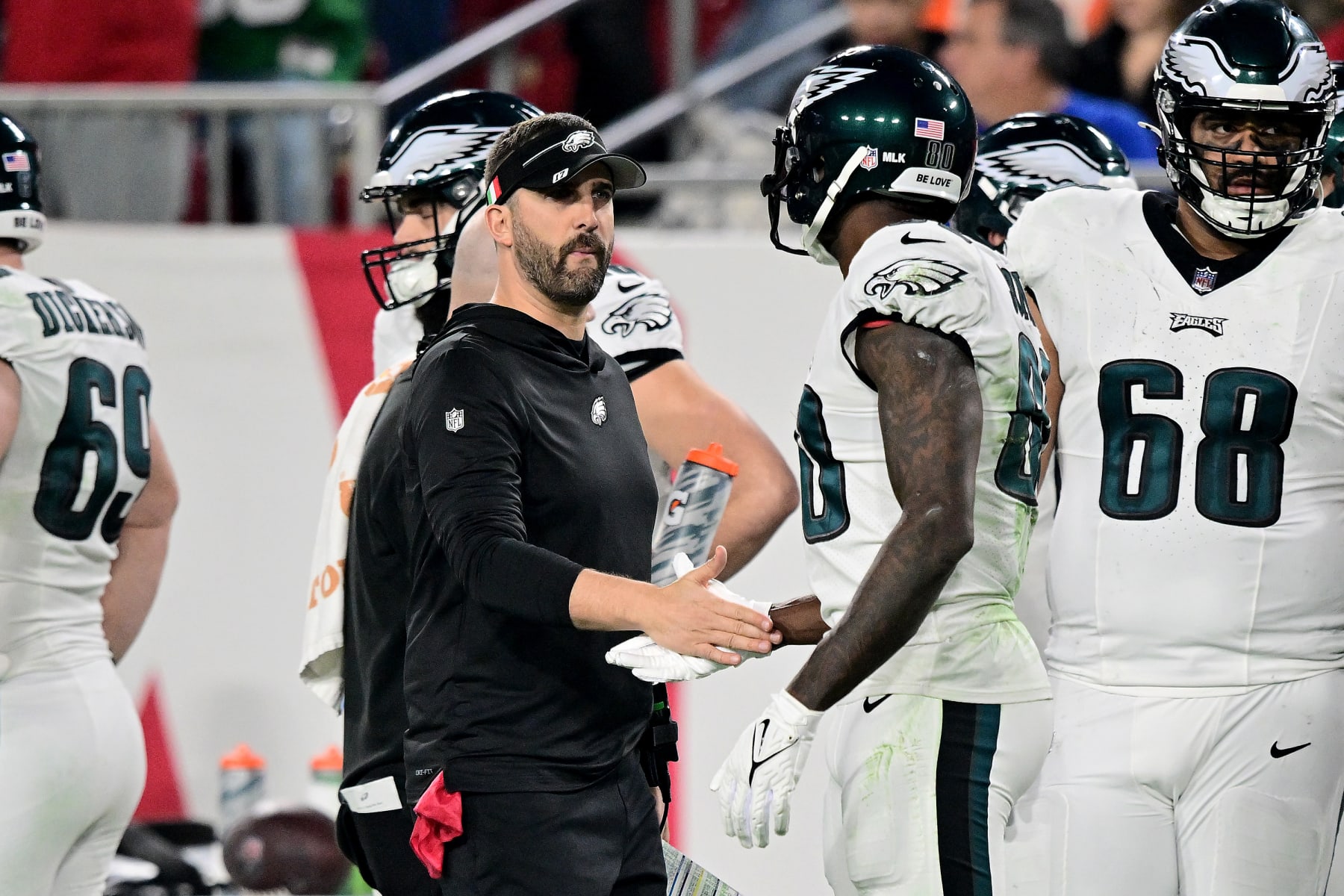 TAMPA, FLORIDA - JANUARY 15: Head coach Nick Sirianni of the Philadelphia Eagles high-fives Julio Jones #80 against the Tampa Bay Buccaneers during the second quarter in the NFC Wild Card Playoffs at Raymond James Stadium on January 15, 2024 in Tampa, Florida. (Photo by Julio Aguilar/Getty Images) TAMPA, FLORIDA - JANUARY 15: Head coach Nick Sirianni of the Philadelphia Eagles high-fives Julio Jones #80 against the Tampa Bay Buccaneers during the second quarter in the NFC Wild Card Playoffs at Raymond James Stadium on January 15, 2024 in Tampa, Florida. (Photo by Julio Aguilar/Getty Images)