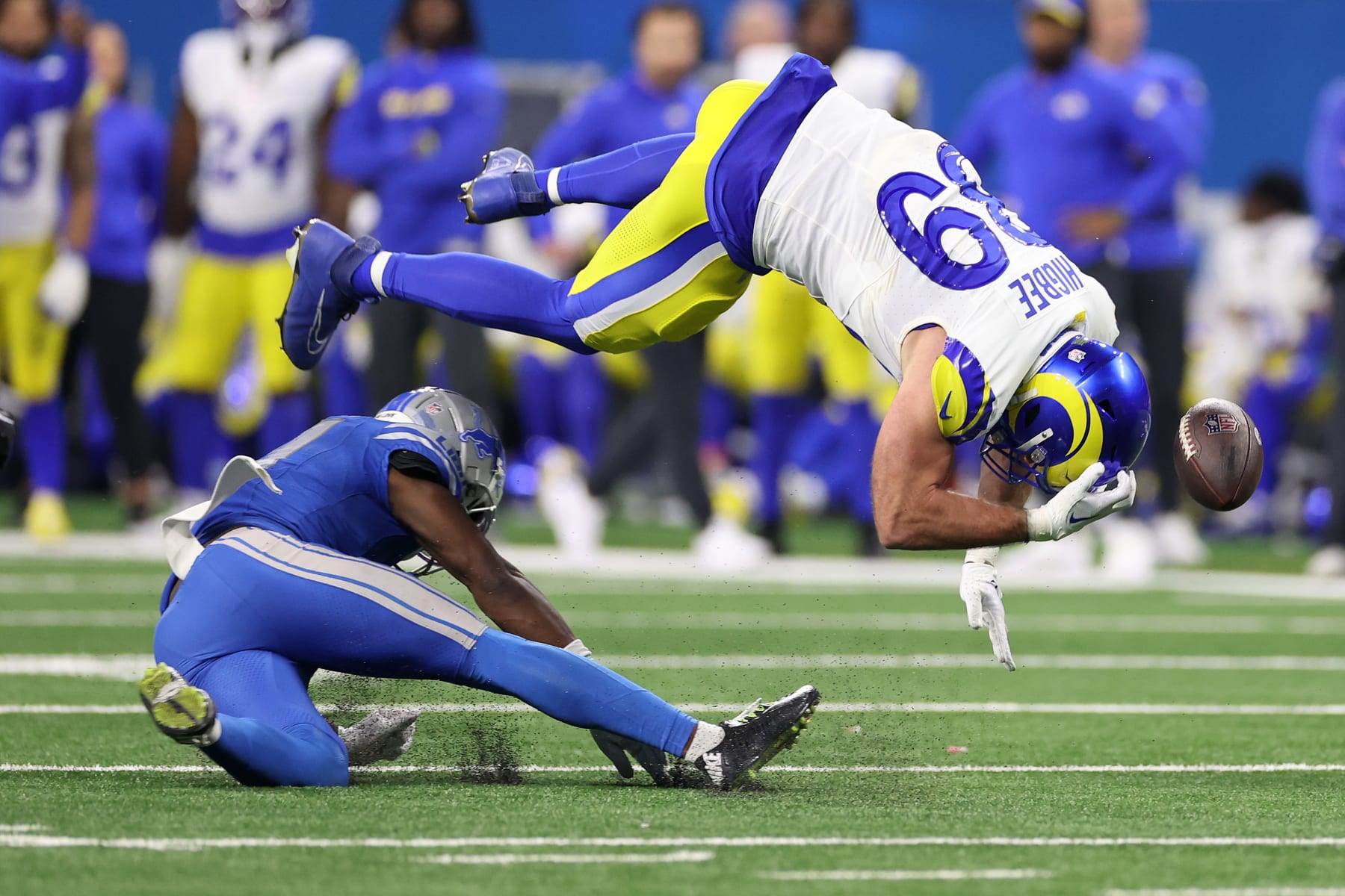DETROIT, MICHIGAN - JANUARY 14: Tyler Higbee #89 of the Los Angeles Rams is hit by Kerby Joseph #31 of the Detroit Lions during the second half in the NFC Wild Card Playoffs at Ford Field on January 14, 2024 in Detroit, Michigan. (Photo by Gregory Shamus/Getty Images)