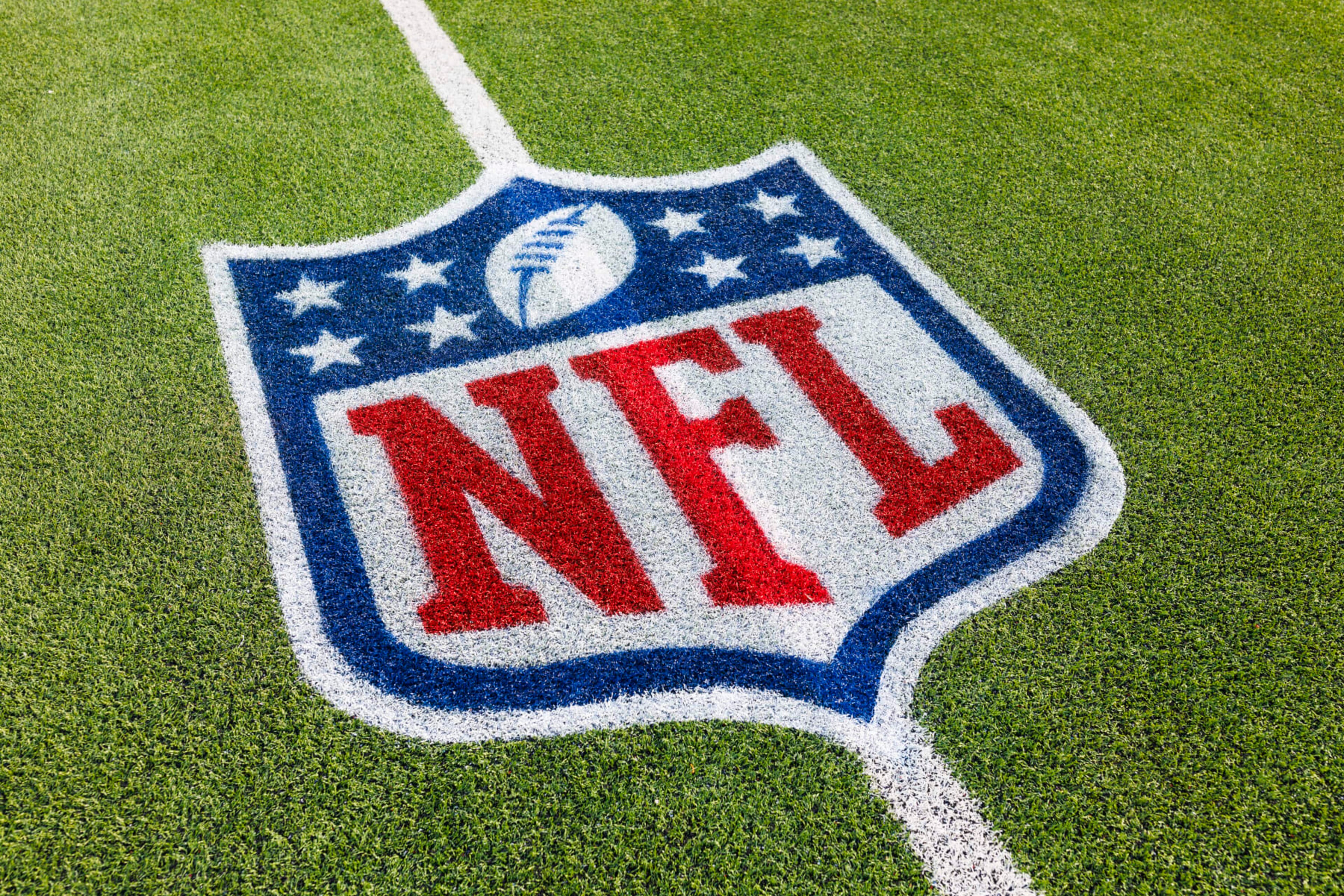 INGLEWOOD, CALIFORNIA - JANUARY 7: A detailed view of an NFL shield logo painted on the field during a game against the Kansas City Chiefs and the Los Angeles Chargers at SoFi Stadium on January 7, 2024 in Inglewood, California. (Photo by Ric Tapia/Getty Images)