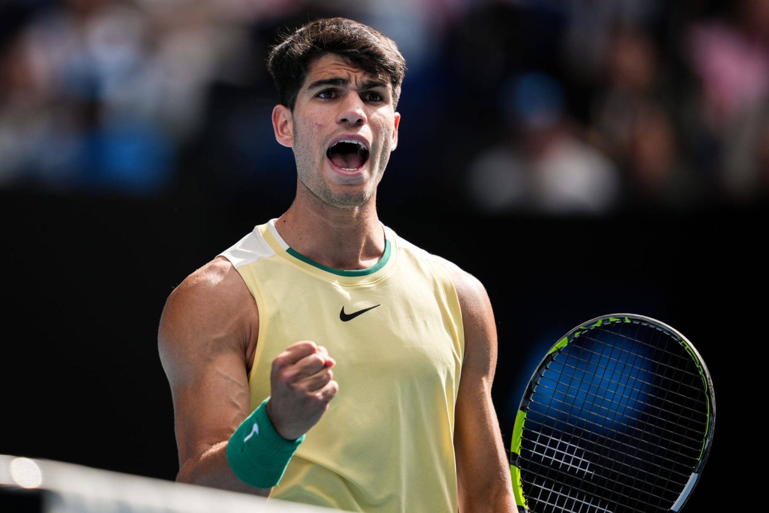 MELBOURNE, AUSTRALIA - JANUARY 18: Carlos Alcaraz of Spain reacts in the Men's Singles Second Round match against Lorenzo Sonego of Italy during day five of the 2024 Australian Open at Melbourne Park on January 18, 2024 in Melbourne, Australia. (Photo by Shi Tang/Getty Images)