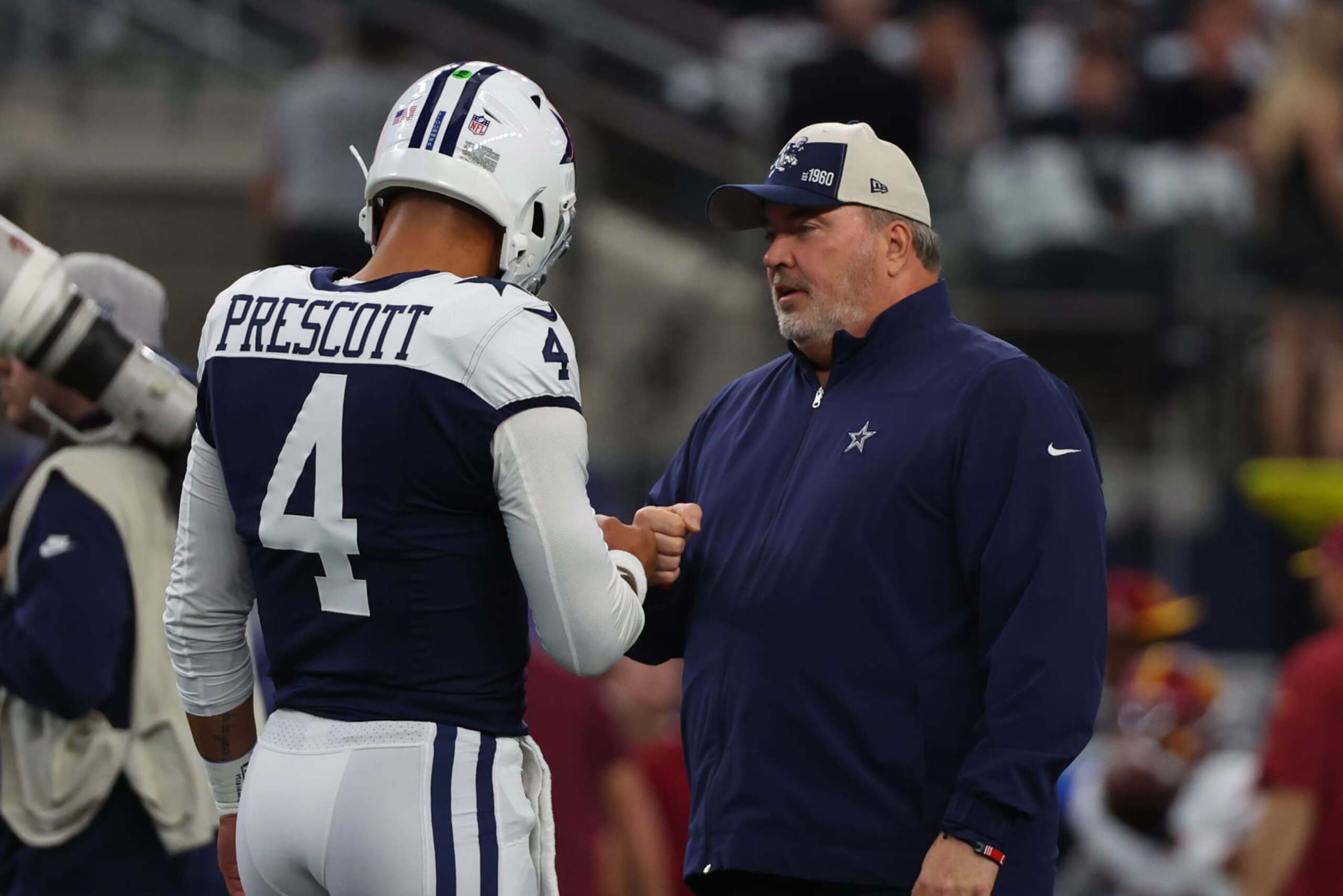 ARLINGTON, TEXAS - NOVEMBER 23: Head coach Mike McCarthy of the Dallas Cowboys interacts with Dak Prescott #4 of the Dallas Cowboys prior to the game against the Washington Commanders at AT&T Stadium on November 23, 2023 in Arlington, Texas. (Photo by Richard Rodriguez/Getty Images)