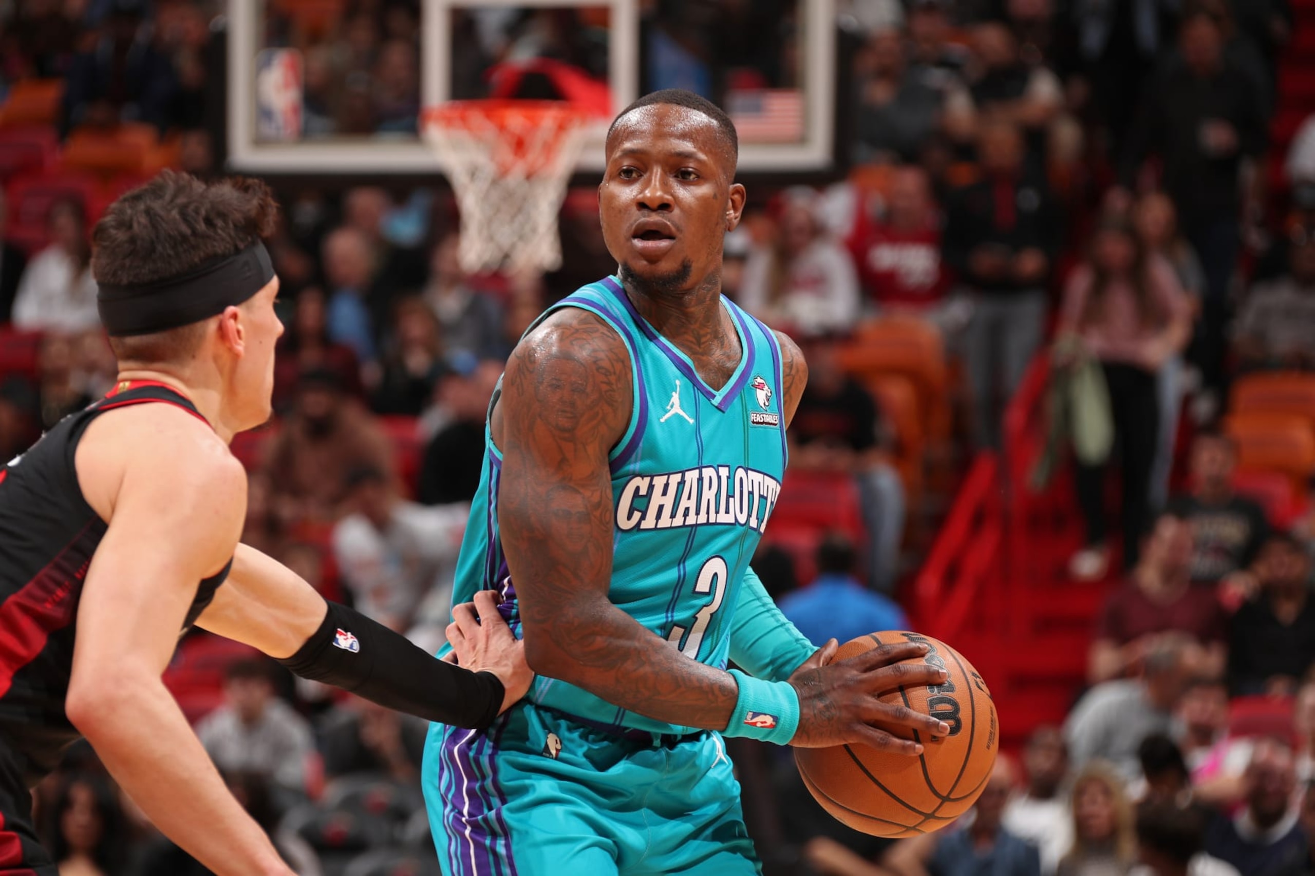 MIAMI, FL - JANUARY 14: Terry Rozier #3 of the Charlotte Hornets looks on during the game against the Miami Heat on January 14, 2024 at Kaseya Center in Miami, Florida. NOTE TO USER: User expressly acknowledges and agrees that, by downloading and or using this Photograph, user is consenting to the terms and conditions of the Getty Images License Agreement. Mandatory Copyright Notice: Copyright 2024 NBAE (Photo by Issac Baldizon/NBAE via Getty Images)