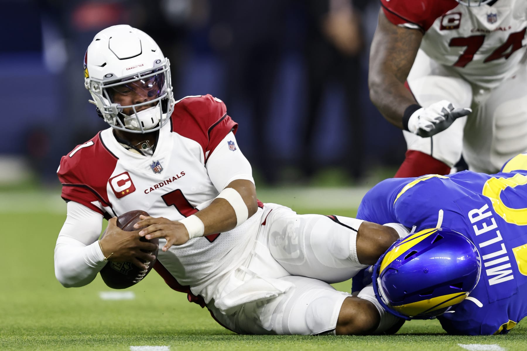 INGLEWOOD, CALIFORNIA - JANUARY 17: Kyler Murray #1 of the Arizona Cardinals scrambles and is sacked by Von Miller #40 of the Los Angeles Rams during the NFC Wild Card at SoFi Stadium on January 17, 2022 in Inglewood, California. The Rams won 34-11. (Photo by Michael Owens/Getty Images)