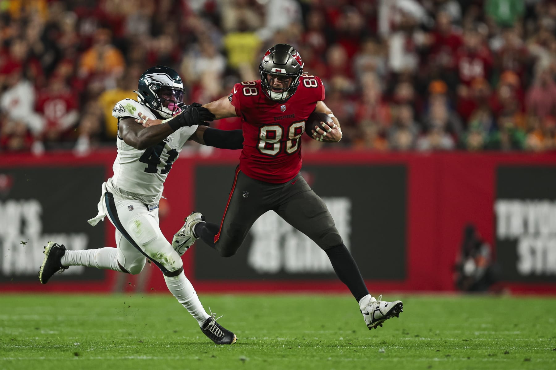 TAMPA, FL - JANUARY 15: Cade Otton #88 of the Tampa Bay Buccaneers runs the ball during an NFL Wild Card playoff football game against the Philadelphia Eagles at Raymond James Stadium on January 15, 2024 in Tampa, Florida. (Photo by Perry Knotts/Getty Images)