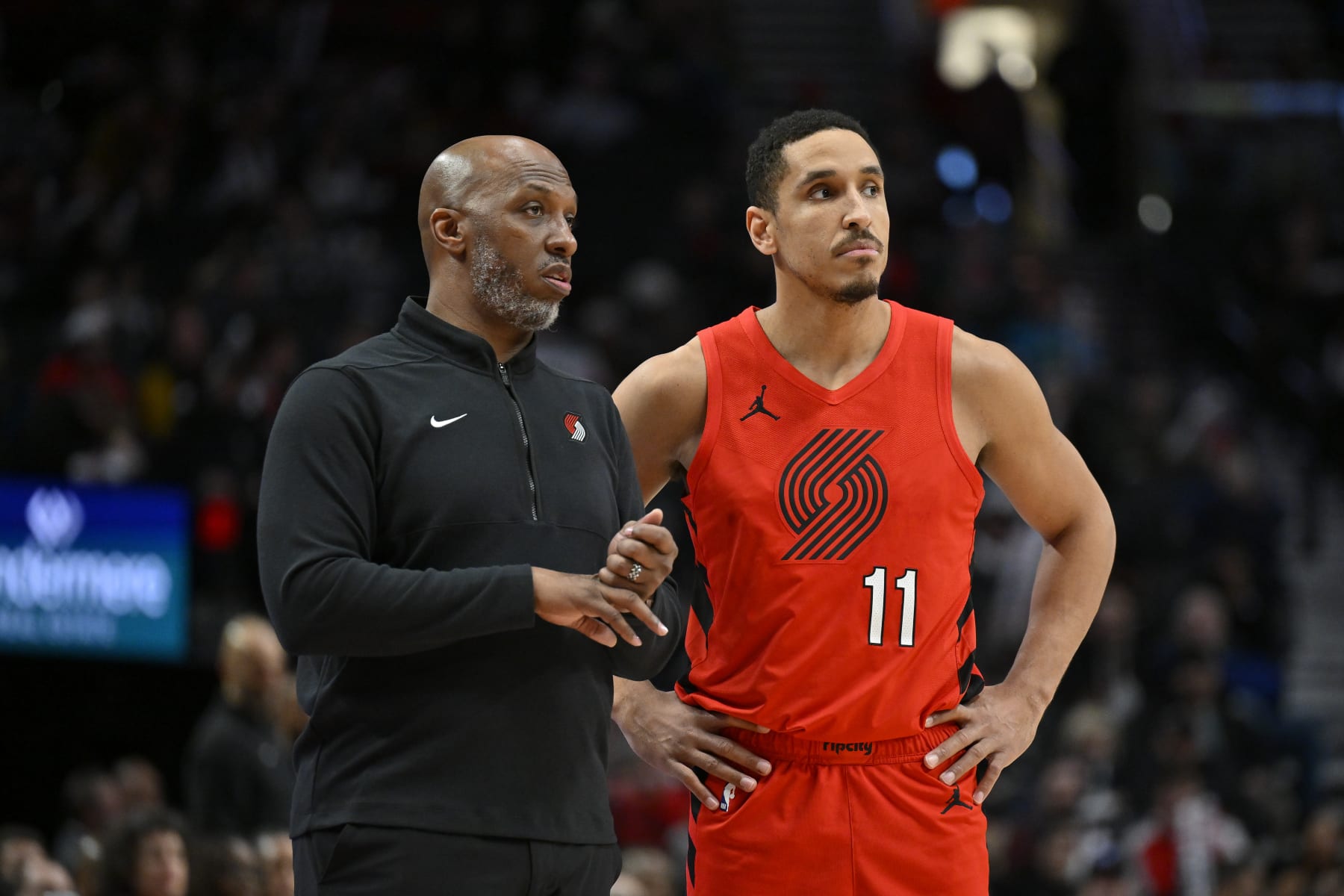 PORTLAND, OREGON - JANUARY 17: Head coach Chauncey Billups and Malcolm Brogdon #11of the Portland Trail Blazers talk during the fourth quarter against the Brooklyn Nets at the Moda Center on January 17, 2024 in Portland, Oregon. The Portland Trail Blazers won 105-103. NOTE TO USER: User expressly acknowledges and agrees that, by downloading and or using this photograph, User is consenting to the terms and conditions of the Getty Images License Agreement. (Photo by Alika Jenner/Getty Images)