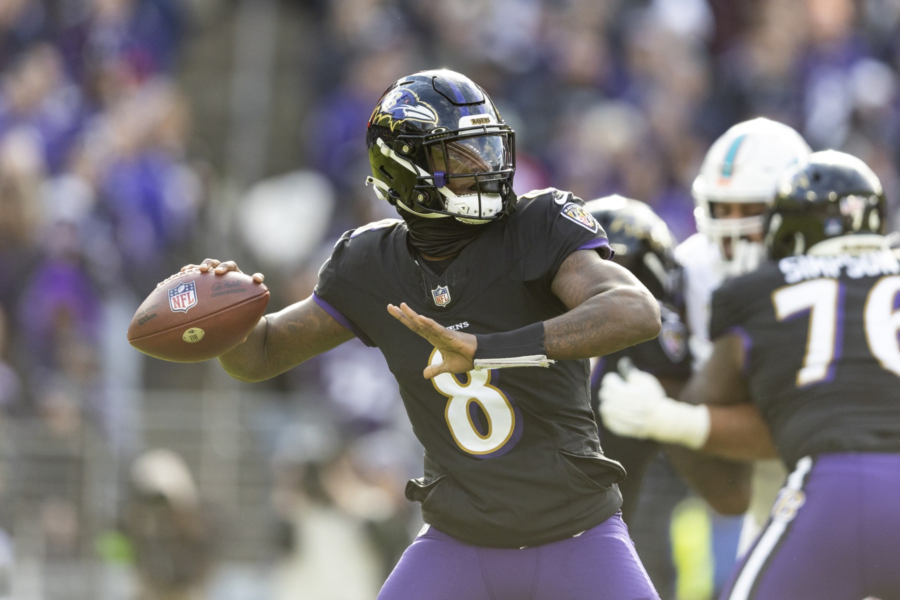 BALTIMORE, MARYLAND - DECEMBER 31: Lamar Jackson #8 of the Baltimore Ravens drops back and looks to pass during an NFL football game between the Baltimore Ravens and the Miami Dolphins at M&T Bank Stadium on December 31, 2023 in Baltimore, Maryland. (Photo by Michael Owens/Getty Images)