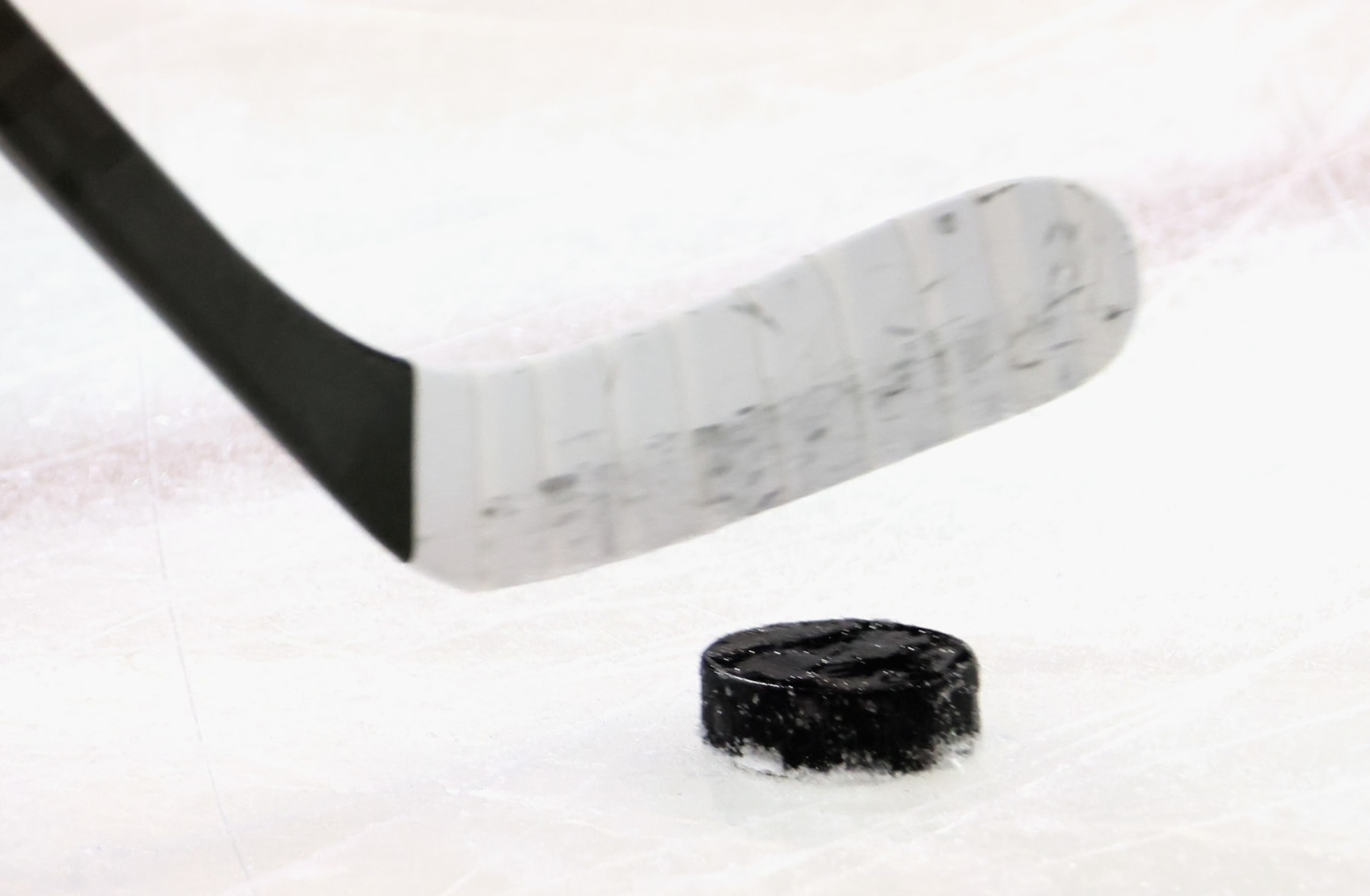 NEW YORK, NEW YORK - APRIL 29: A graphic shot of a hockey stick and puck as shot during warm-ups prior to the game between the New York Rangers and the New Jersey Devils in Game Six of the First Round of the 2023 Stanley Cup Playoffs at Madison Square Garden on April 29, 2023 in New York, New York. The Rangers defeated the Devils 5-2. (Photo by Bruce Bennett/Getty Images)