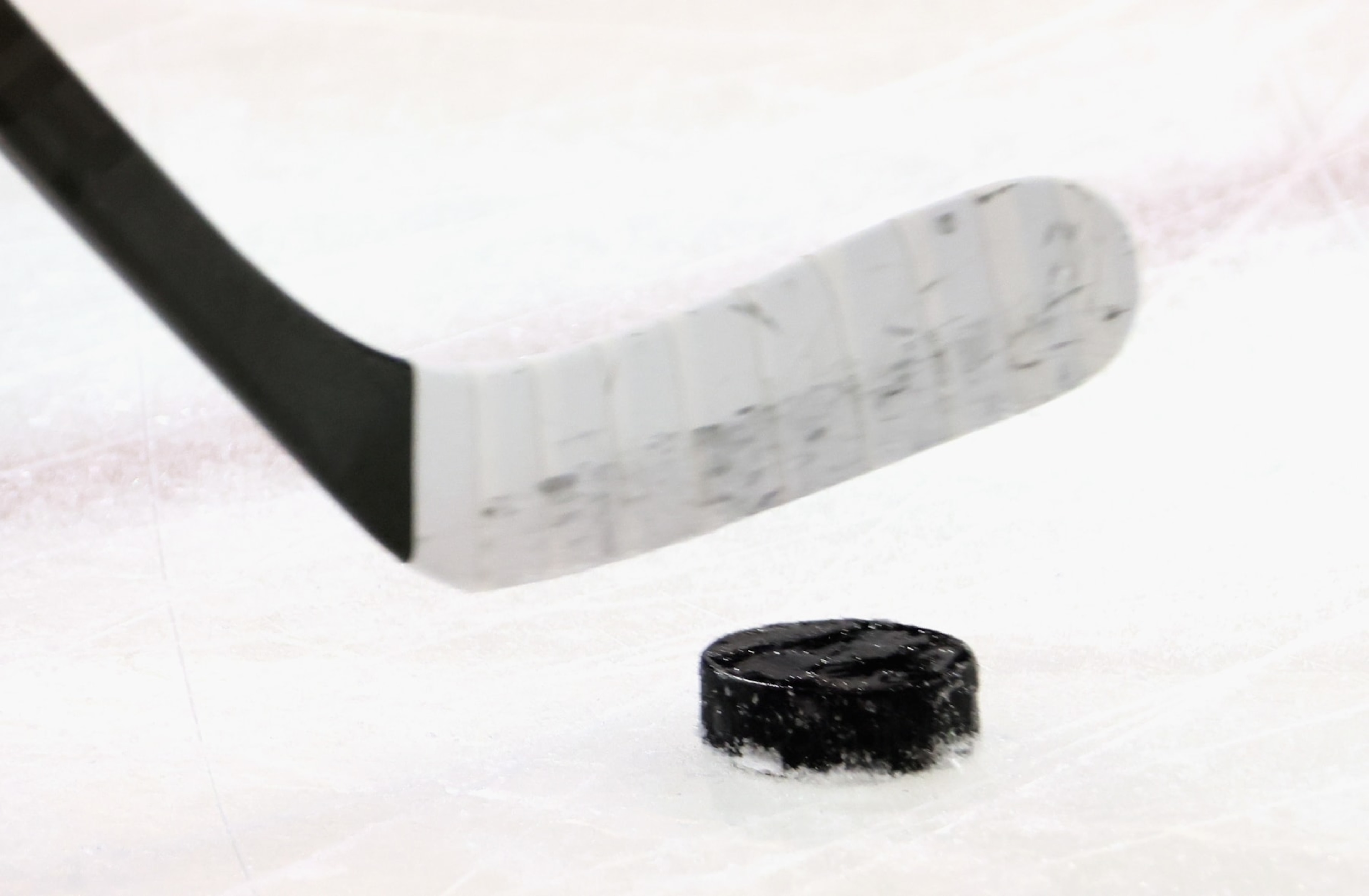 NEW YORK, NEW YORK - APRIL 29: A graphic shot of a hockey stick and puck as shot during warm-ups prior to the game between the New York Rangers and the New Jersey Devils in Game Six of the First Round of the 2023 Stanley Cup Playoffs at Madison Square Garden on April 29, 2023 in New York, New York. The Rangers defeated the Devils 5-2. (Photo by Bruce Bennett/Getty Images)