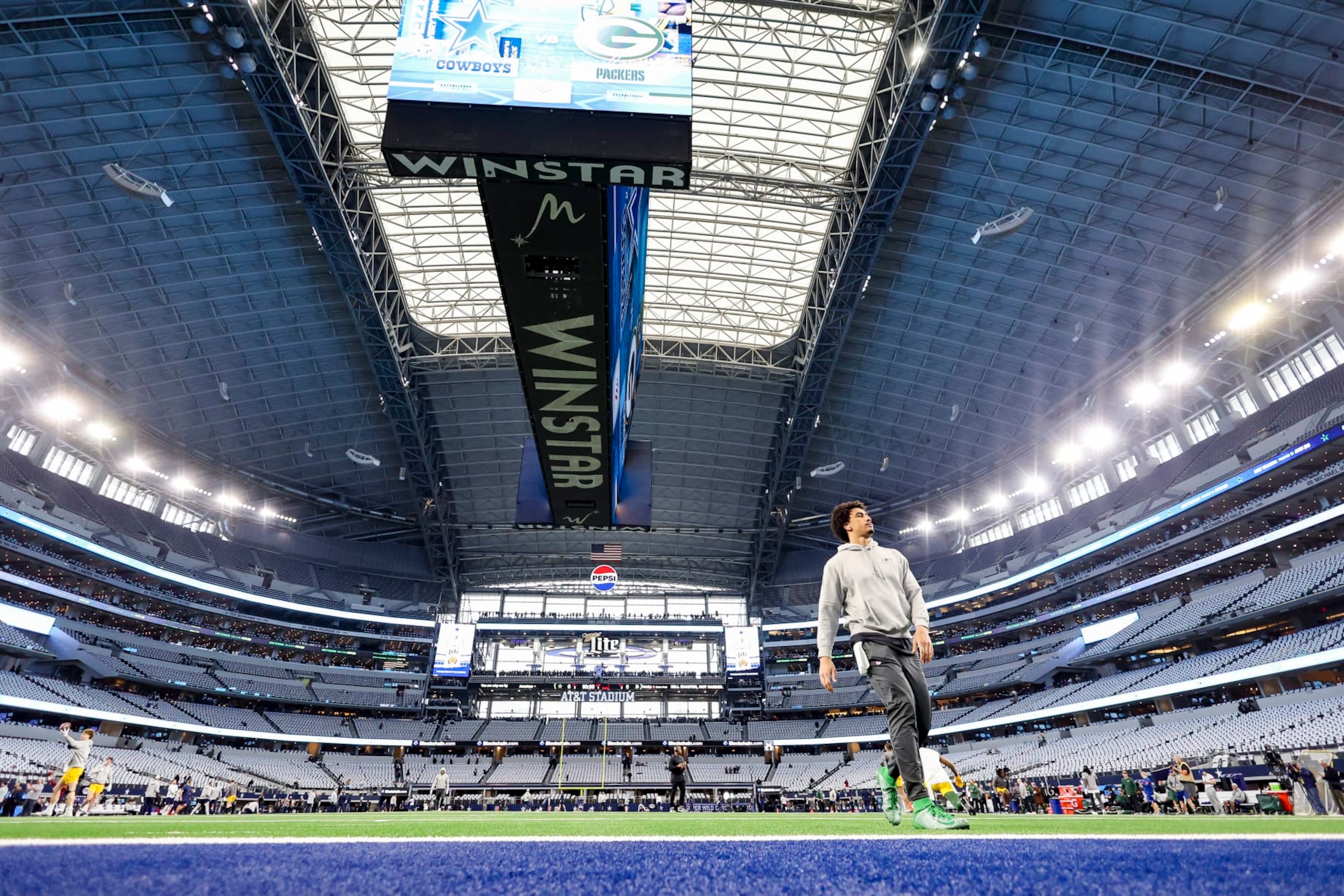 ARLINGTON, TX - JANUARY 14: Jordan Love #10 of the Green Bay Packers warms up prior to an NFL wild-card playoff football game against the Dallas Cowboys at AT&T Stadium on January 14, 2024 in Arlington, Texas. (Photo by Perry Knotts/Getty Images)