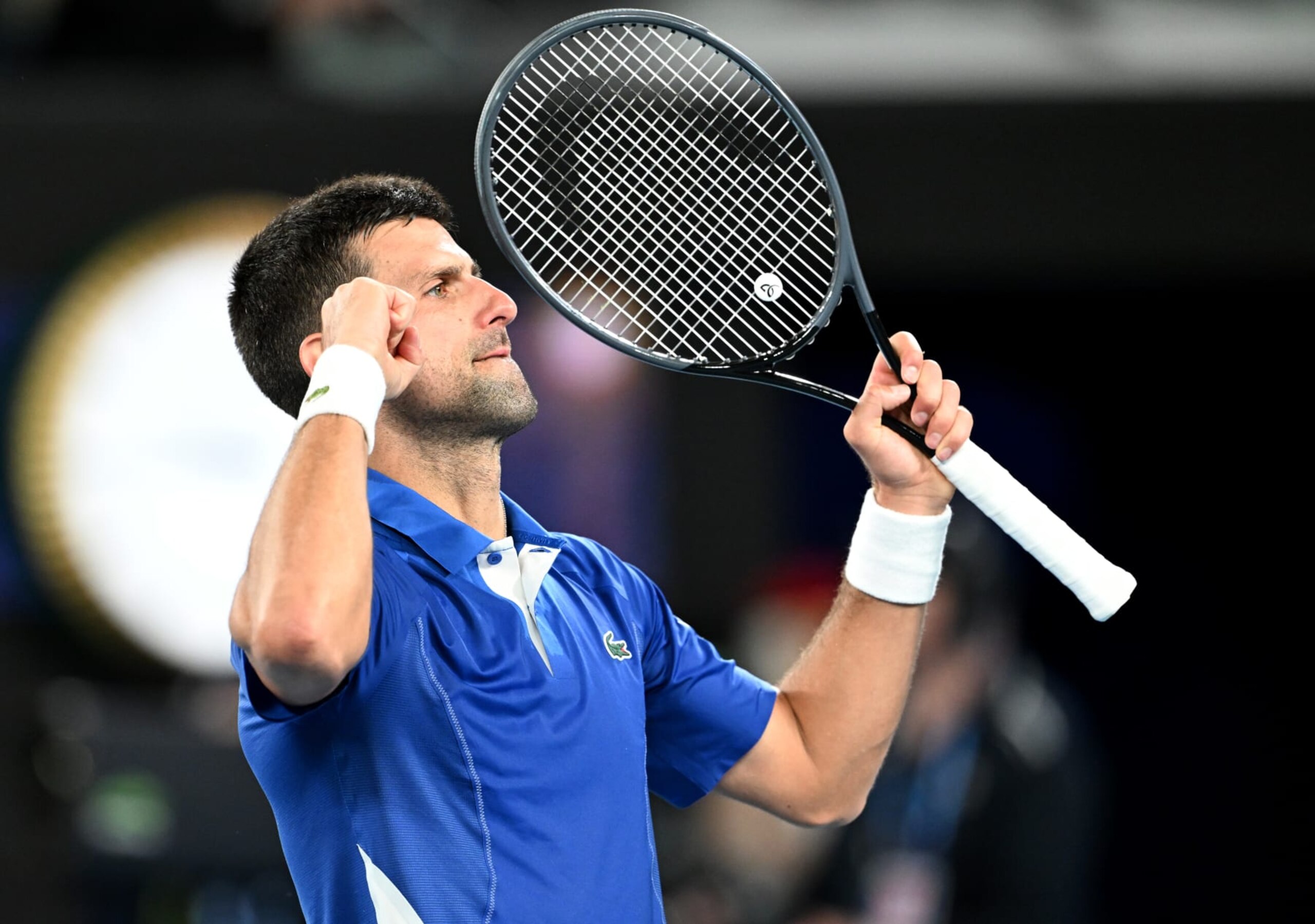 MELBOURNE, AUSTRALIA - JANUARY 19: Novak Djokovic of Serbia celebrates the victory in the Men's Singles Third Round match against Tomas Martin Etcheverry of Argentina during the 2024 Australian Open at Melbourne Park on January 19, 2024 in Melbourne, Australia. (Photo by Will Murray/Getty Images)