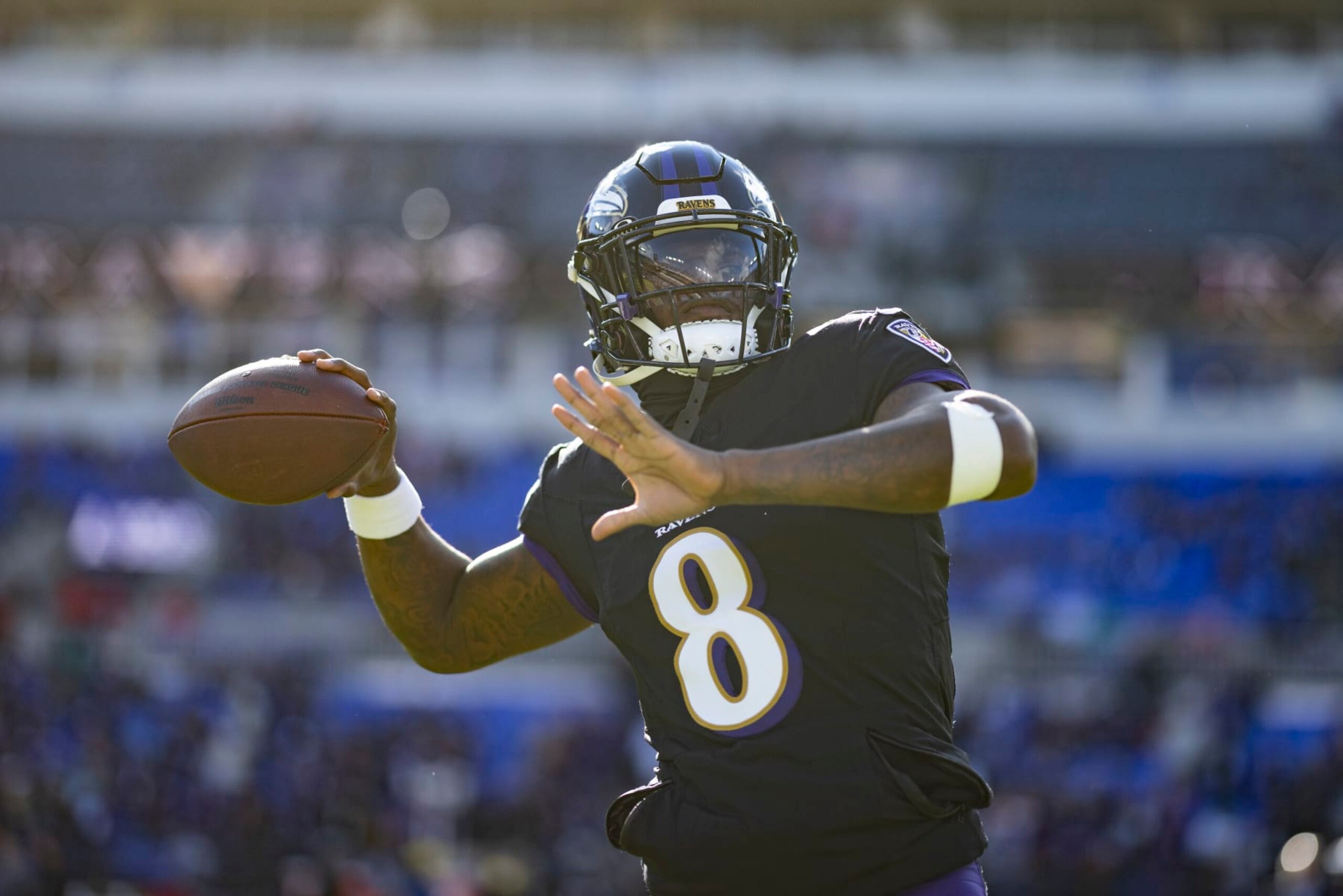 BALTIMORE, MARYLAND - DECEMBER 31: Lamar Jackson #8 of the Baltimore Ravens looks to pass as he warms up prior to an NFL football game between the Baltimore Ravens and the Miami Dolphins at M&T Bank Stadium on December 31, 2023 in Baltimore, Maryland. (Photo by Michael Owens/Getty Images)