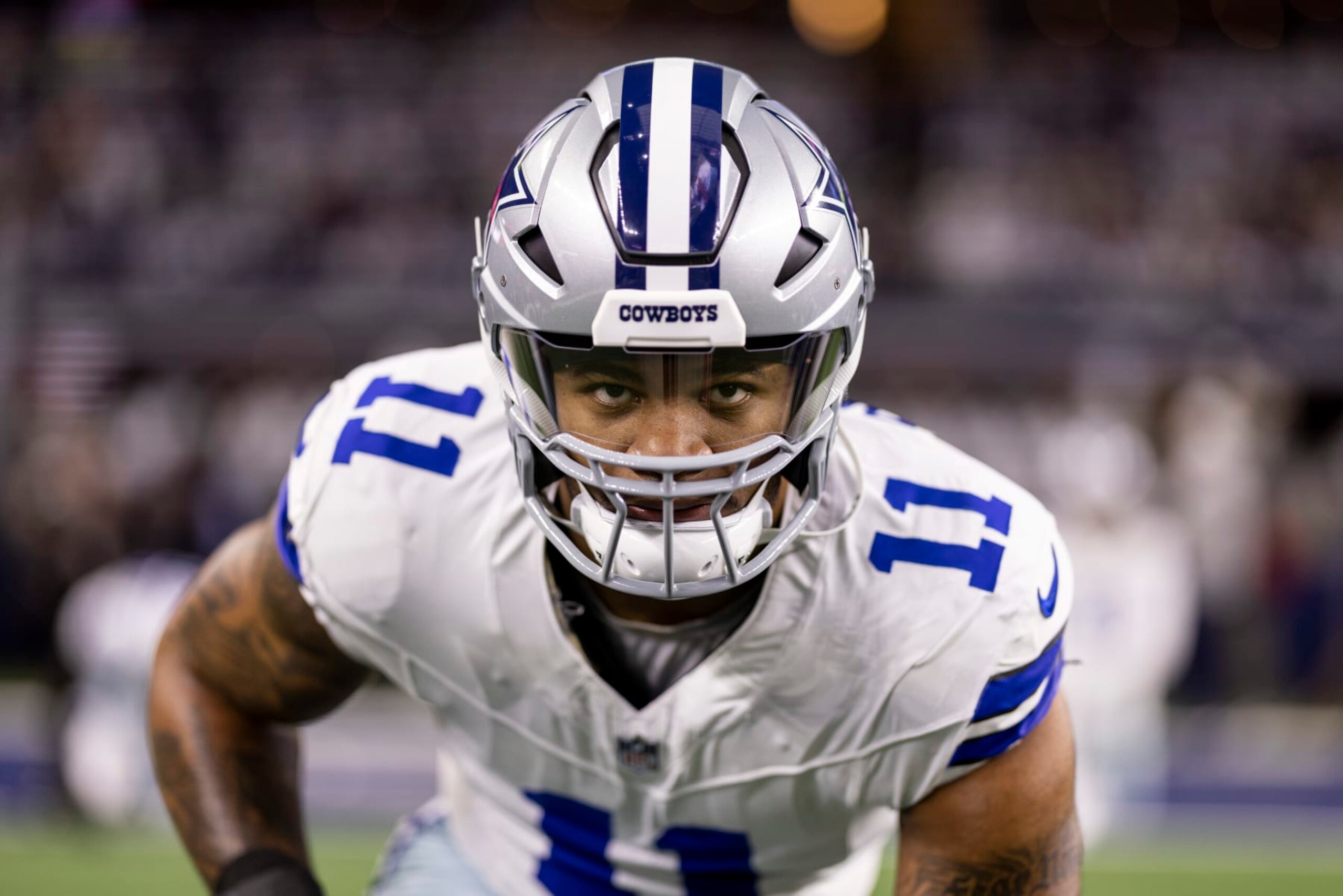ARLINGTON, TEXAS - JANUARY 14: Micah Parsons #11 of the Dallas Cowboys looks on as he stretches during warm ups prior to an NFL wild-card playoff football game between the Dallas Cowboys and the Green Bay Packers at AT&T Stadium on January 14, 2024 in Arlington, Texas. (Photo by Michael Owens/Getty Images)