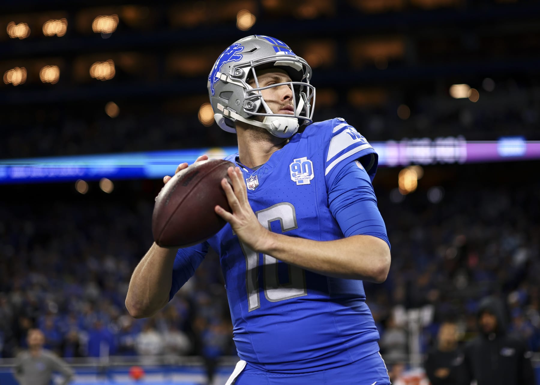 DETROIT, MI - JANUARY 14: Jared Goff #16 of the Detroit Lions warms up prior to an NFL wild-card playoff football game against the Los Angeles Rams at Ford Field on January 14, 2024 in Detroit, Michigan. (Photo by Kevin Sabitus/Getty Images)