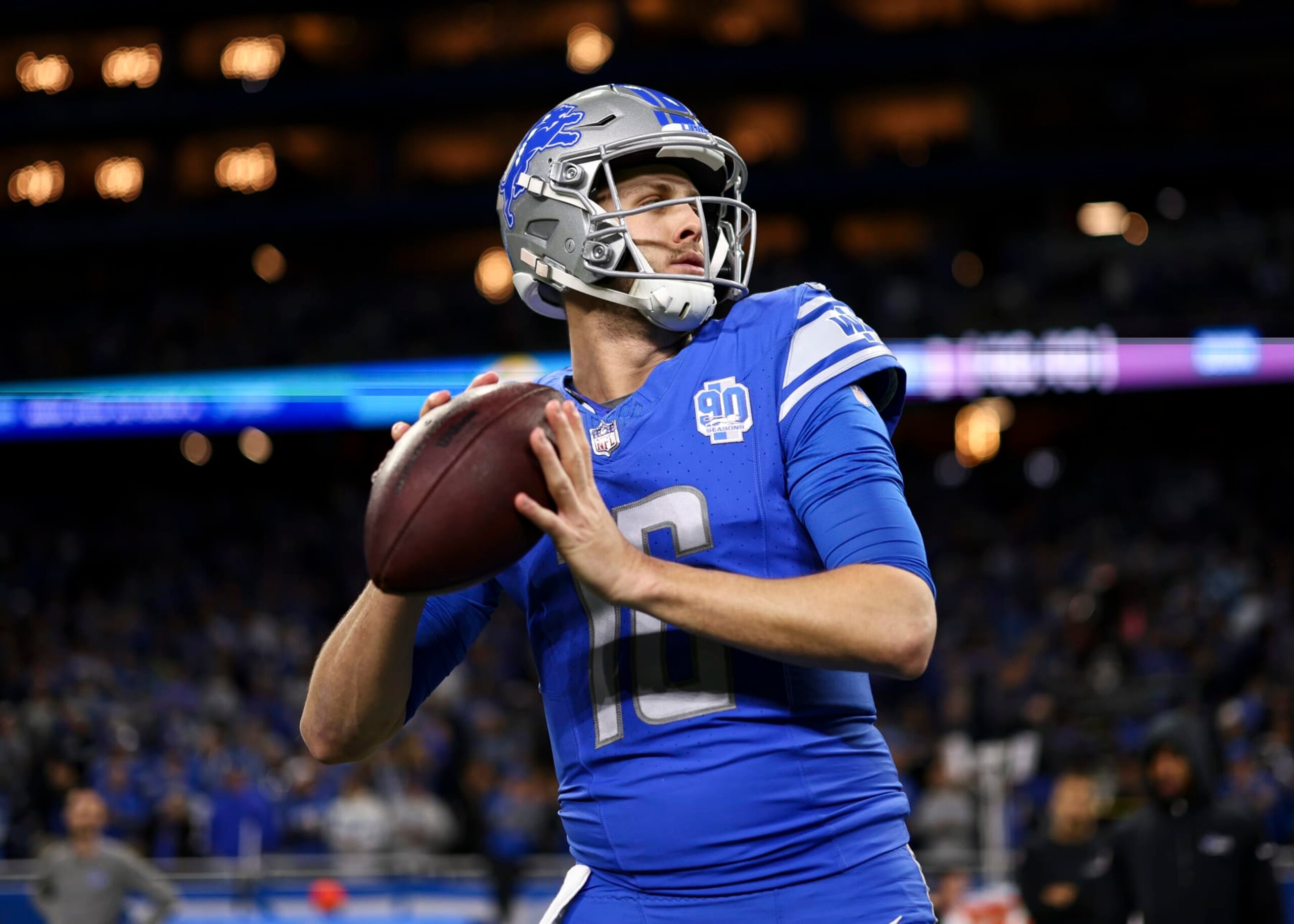 DETROIT, MI - JANUARY 14: Jared Goff #16 of the Detroit Lions warms up prior to an NFL wild-card playoff football game against the Los Angeles Rams at Ford Field on January 14, 2024 in Detroit, Michigan. (Photo by Kevin Sabitus/Getty Images)