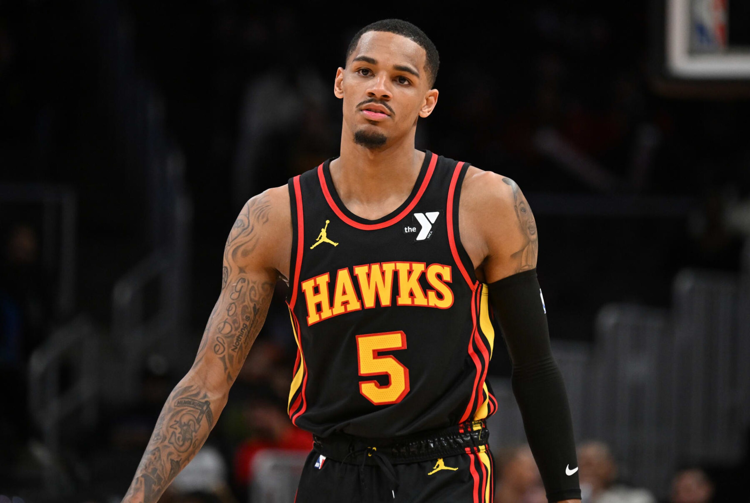ATLANTA, GEORGIA - JANUARY 12: Dejounte Murray #5 of the Atlanta Hawks looks on during the game against the Indiana Pacers on January 12, 2024 at State Farm Arena in Atlanta, Georgia.  NOTE TO USER: User expressly acknowledges and agrees that, by downloading and or using this photograph, User is consenting to the terms and conditions of the Getty Images License Agreement. (Photo by Paras Griffin/Getty Images)