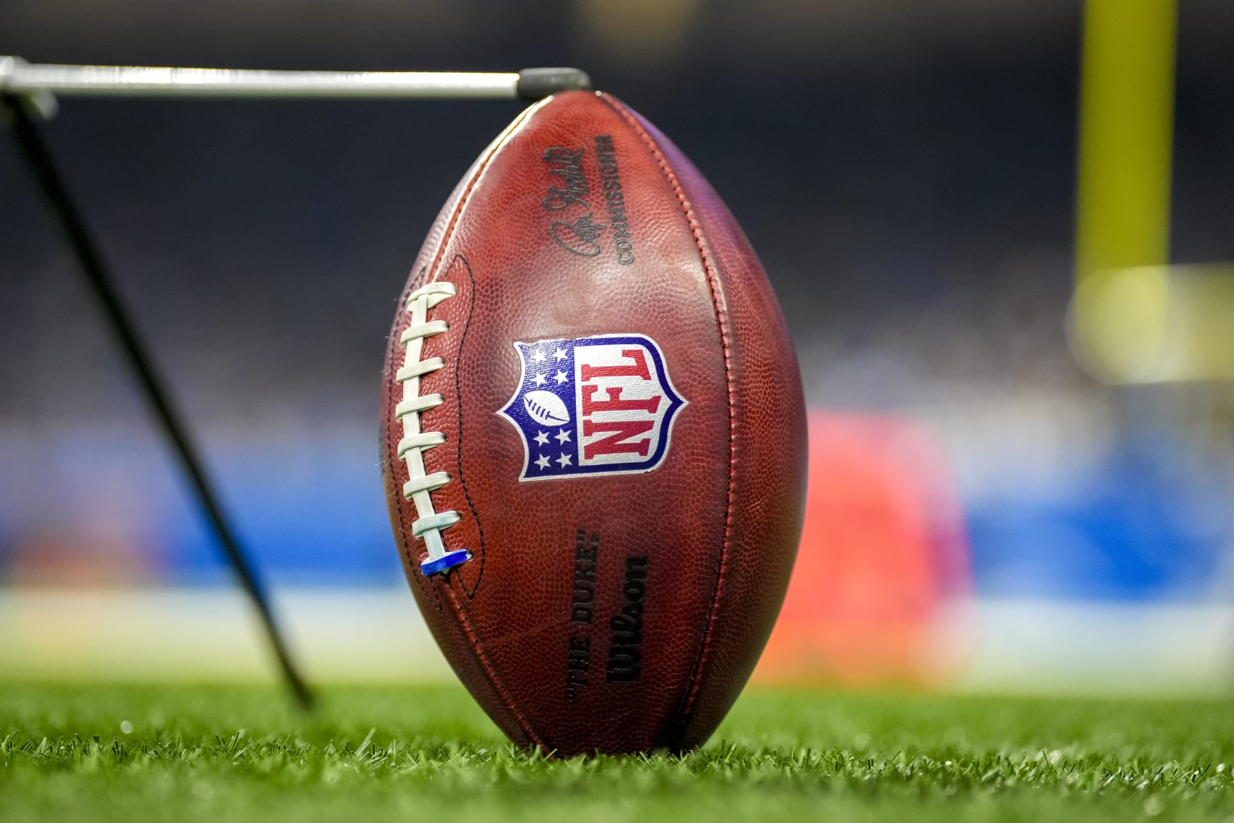 DETROIT, MICHIGAN - JANUARY 07: A detail of a Wilson brand NFL The Duke football held up by a kicking tee during the game between the Minnesota Vikings and Detroit Lions Ford Field on January 07, 2024 in Detroit, Michigan. (Photo by Nic Antaya/Getty Images)