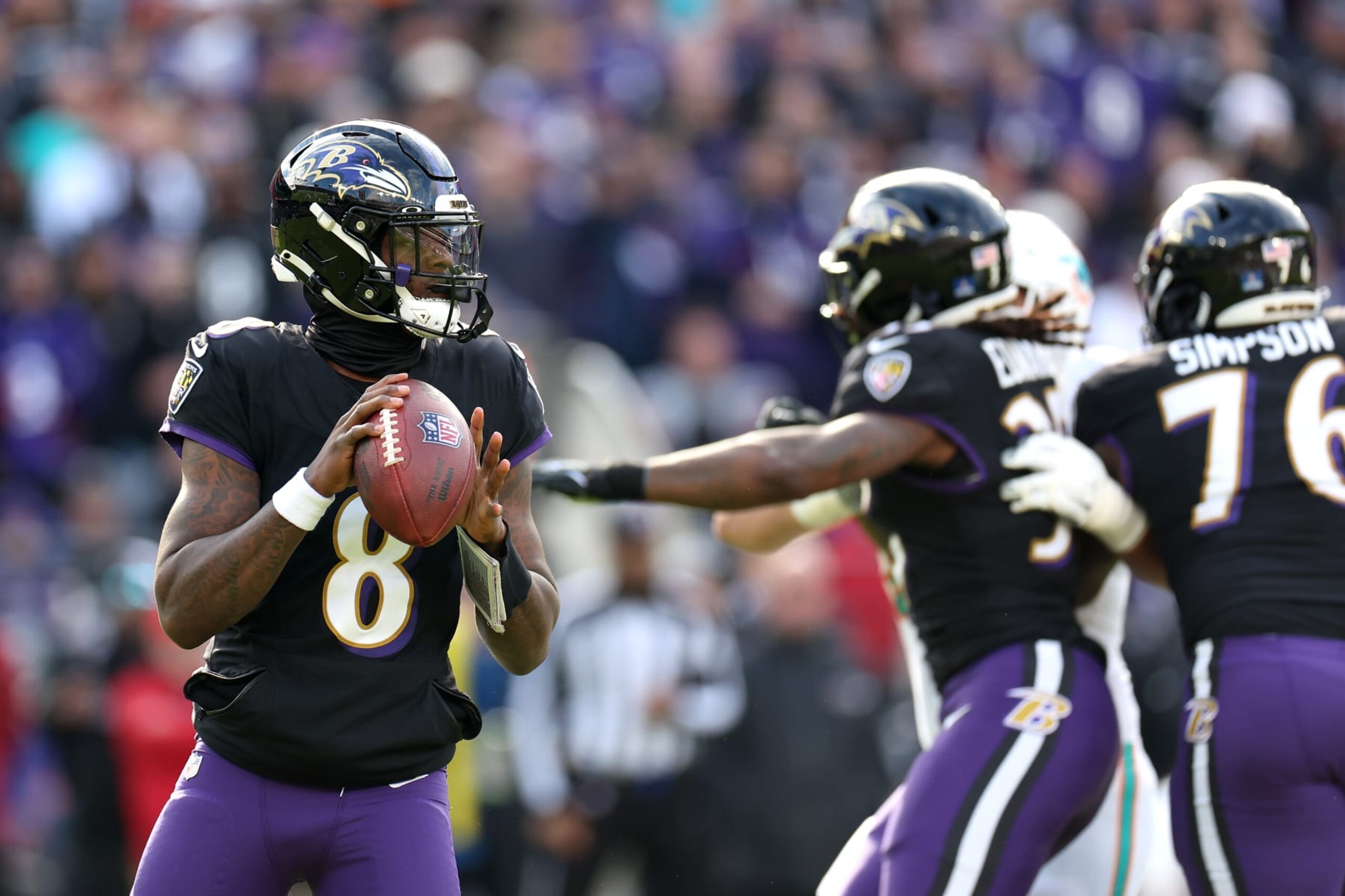BALTIMORE, MARYLAND - DECEMBER 31: Quarterback Lamar Jackson #8 of the Baltimore Ravens drops back to pass against the Miami Dolphins in the first half at M&T Bank Stadium on December 31, 2023 in Baltimore, Maryland. (Photo by Rob Carr/Getty Images) BALTIMORE, MARYLAND - DECEMBER 31: Quarterback Lamar Jackson #8 of the Baltimore Ravens drops back to pass against the Miami Dolphins in the first half at M&T Bank Stadium on December 31, 2023 in Baltimore, Maryland. (Photo by Rob Carr/Getty Images)