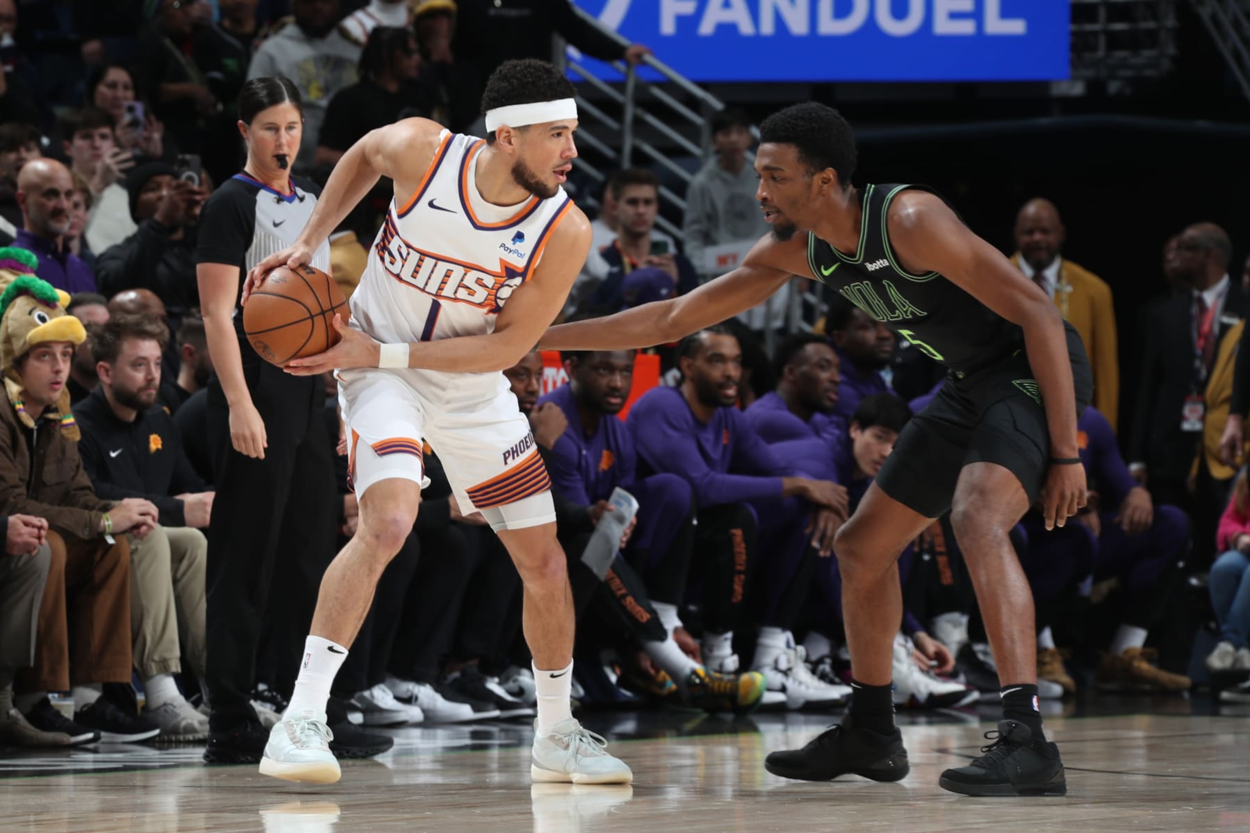 NEW ORLEANS, LA - JANUARY 19: Devin Booker #1 of the Phoenix Suns handles the ball during the game against the New Orleans Pelicans on January 19, 2024 at the Smoothie King Center in New Orleans, Louisiana. NOTE TO USER: User expressly acknowledges and agrees that, by downloading and or using this Photograph, user is consenting to the terms and conditions of the Getty Images License Agreement. Mandatory Copyright Notice: Copyright 2024 NBAE (Photo by Layne Murdoch Jr./NBAE via Getty Images) NEW ORLEANS, LA - JANUARY 19: Devin Booker #1 of the Phoenix Suns handles the ball during the game against the New Orleans Pelicans on January 19, 2024 at the Smoothie King Center in New Orleans, Louisiana. NOTE TO USER: User expressly acknowledges and agrees that, by downloading and or using this Photograph, user is consenting to the terms and conditions of the Getty Images License Agreement. Mandatory Copyright Notice: Copyright 2024 NBAE (Photo by Layne Murdoch Jr./NBAE via Getty Images)