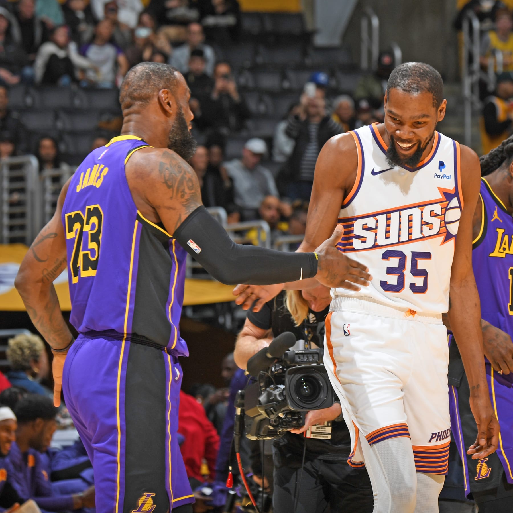 LOS ANGELES, CA - JANUARY 11: LeBron James #23 of the Los Angeles Lakers high fives Kevin Durant #35 of the Phoenix Suns before the game on January 11, 2024 at Crypto.Com Arena in Los Angeles, California. NOTE TO USER: User expressly acknowledges and agrees that, by downloading and/or using this Photograph, user is consenting to the terms and conditions of the Getty Images License Agreement. Mandatory Copyright Notice: Copyright 2024 NBAE (Photo by Andrew D. Bernstein/NBAE via Getty Images)