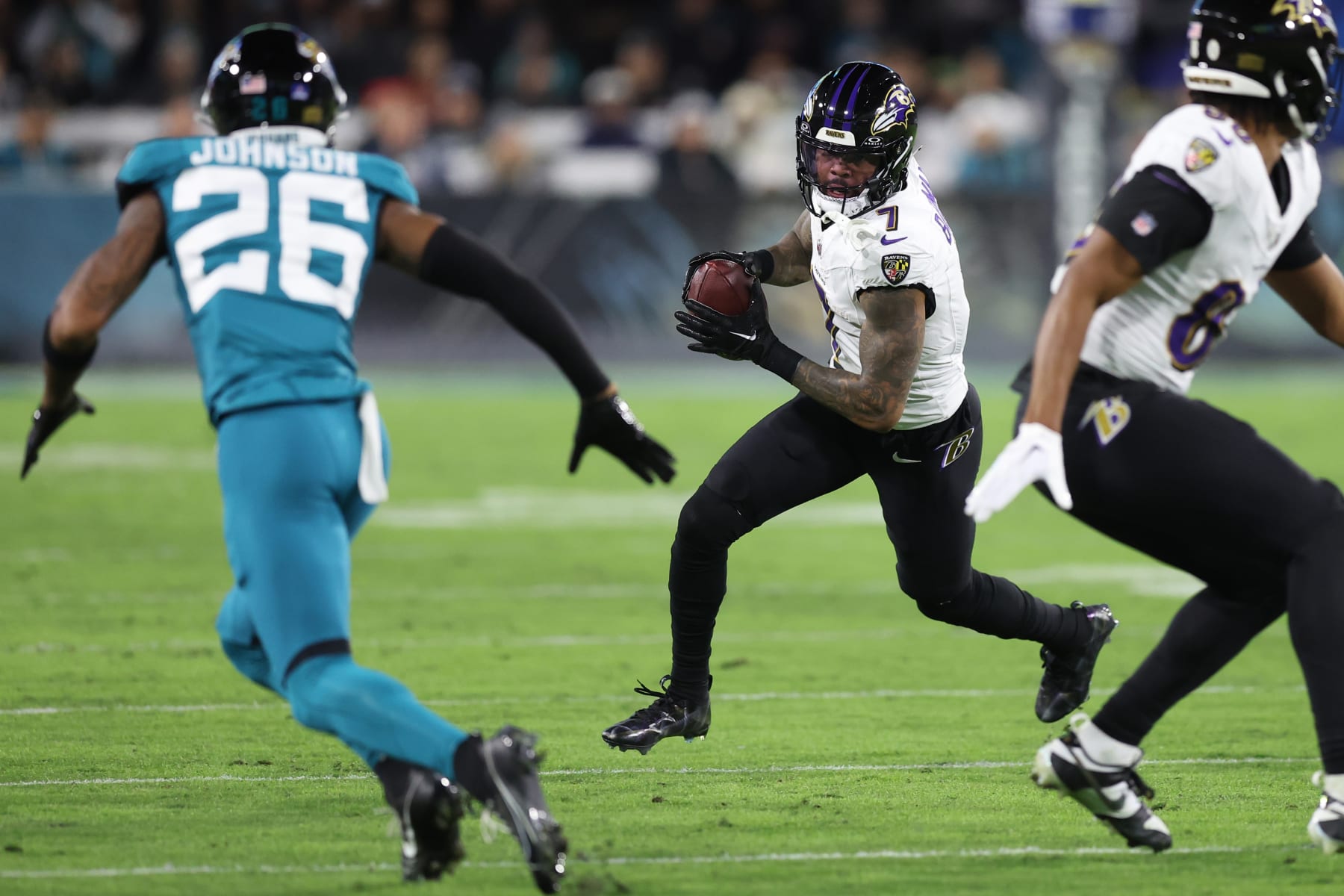 JACKSONVILLE, FLORIDA - DECEMBER 17: Rashod Bateman #7 of the Baltimore Ravens runs with the ball against the Jacksonville Jaguars during the first quarter at EverBank Stadium on December 17, 2023 in Jacksonville, Florida. (Photo by Mike Carlson/Getty Images)