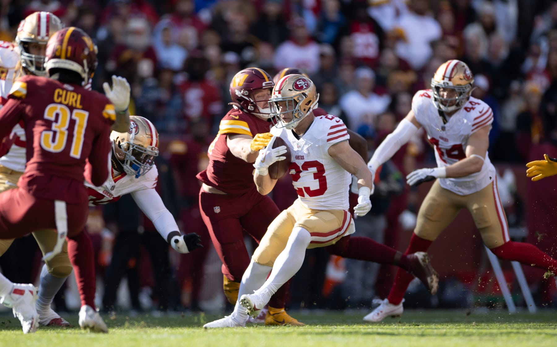 LANDOVER, MD - DECEMBER 31: Christian McCaffrey #23 of the San Francisco 49ers rushes during the game against the Washington Commanders at FedEx Field on December 31, 2023 in Landover, Maryland. The 49ers defeated the Commanders 27-10. (Photo by Michael Zagaris/San Francisco 49ers/Getty Images)