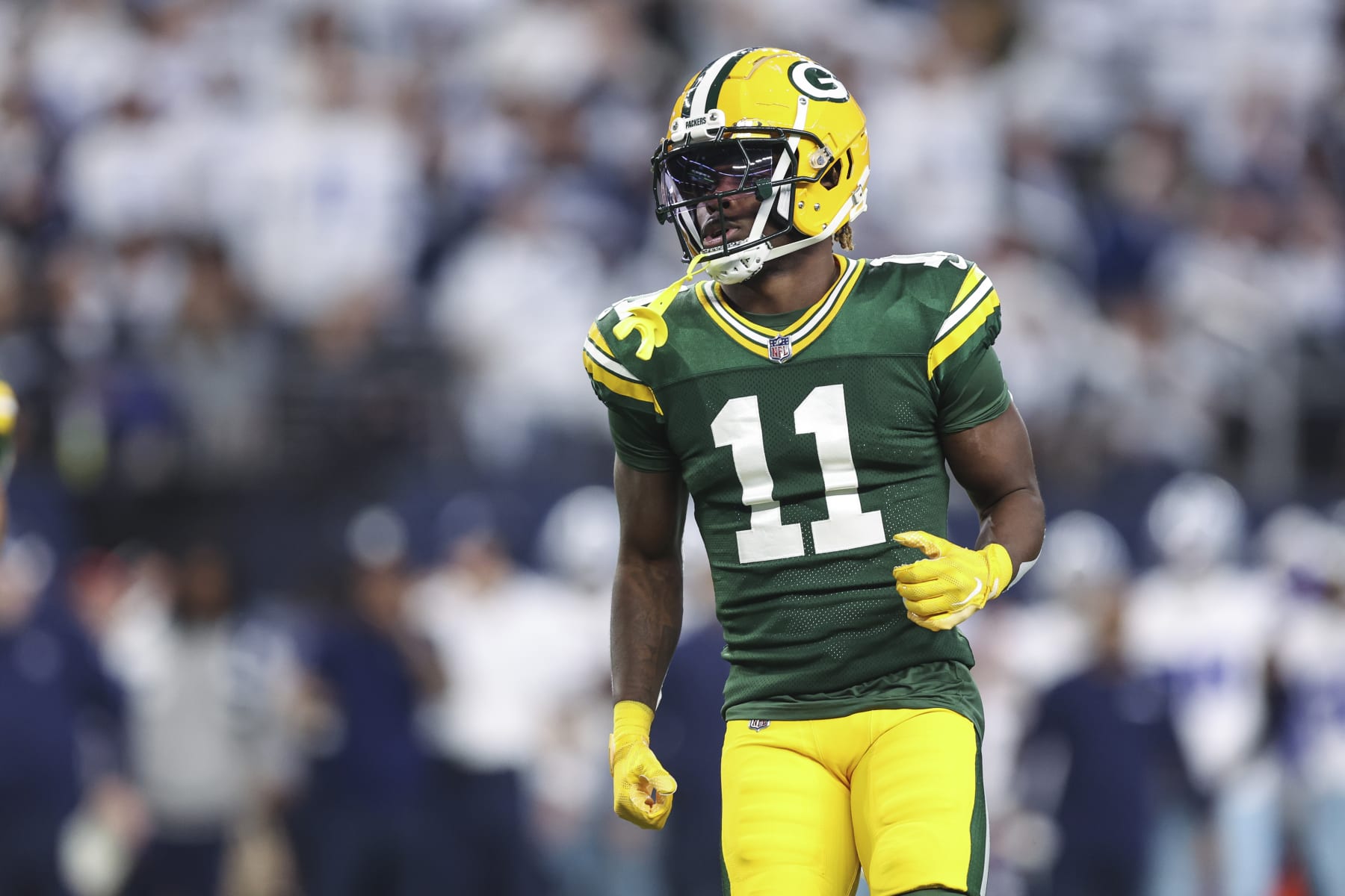 ARLINGTON, TX - JANUARY 14: Jayden Reed #11 of the Green Bay Packers looks on from the field during an NFL wild-card playoff football game against the Dallas Cowboys at AT&T Stadium on January 14, 2024 in Arlington, Texas. (Photo by Perry Knotts/Getty Images)