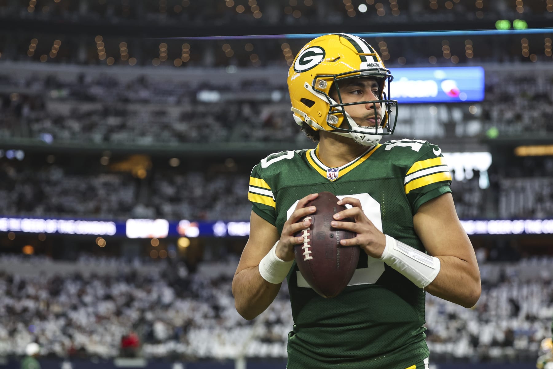 ARLINGTON, TX - JANUARY 14: Jordan Love #10 of the Green Bay Packers warms up prior to an NFL wild-card playoff football game against the Dallas Cowboys at AT&T Stadium on January 14, 2024 in Arlington, Texas. (Photo by Perry Knotts/Getty Images)