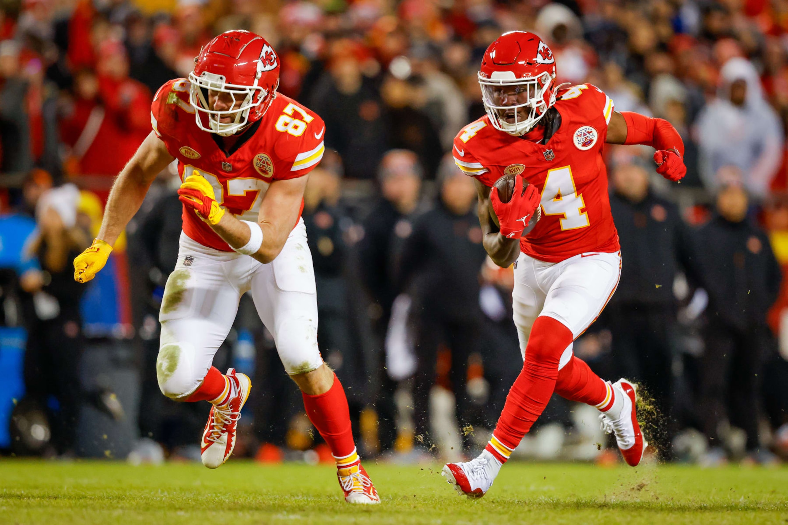 KANSAS CITY, MISSOURI - DECEMBER 31: Rashee Rice #4 of the Kansas City Chiefs runs after a pass catch near Travis Kelce #87 (L) of the Kansas City Chiefs during the third quarter against the Cincinnati Bengals at GEHA Field at Arrowhead Stadium on December 31, 2023 in Kansas City, Missouri. (Photo by David Eulitt/Getty Images)