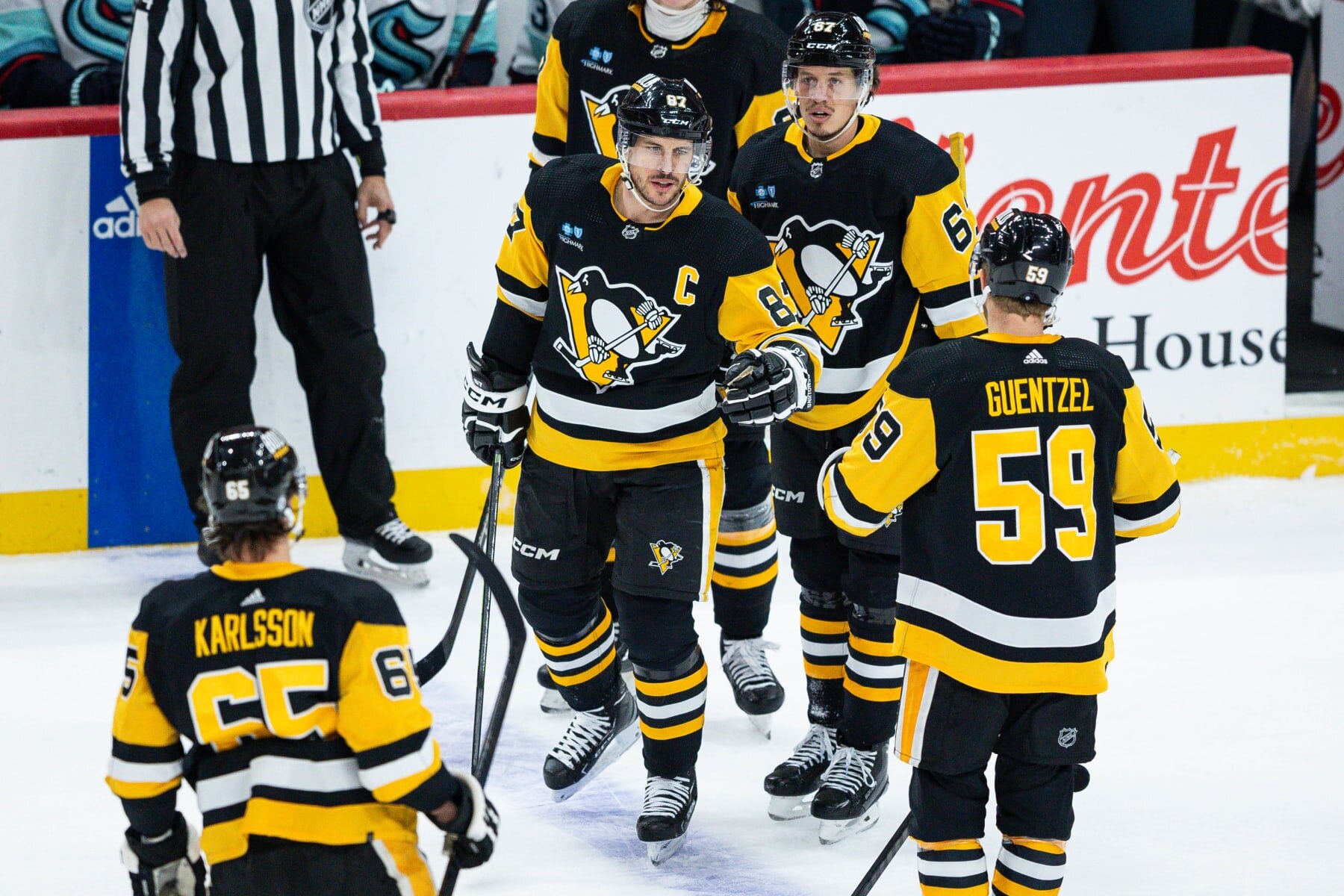 PITTSBURGH, PENNSYLVANIA - JANUARY 15: Sidney Crosby #87 of the Pittsburgh Penguins celebrates with teammates after scoring his second goal of the game against the Seattle Kraken during the third period at PPG PAINTS Arena on January 15, 2024 in Pittsburgh, Pennsylvania. (Photo by Harrison Barden/Getty Images)