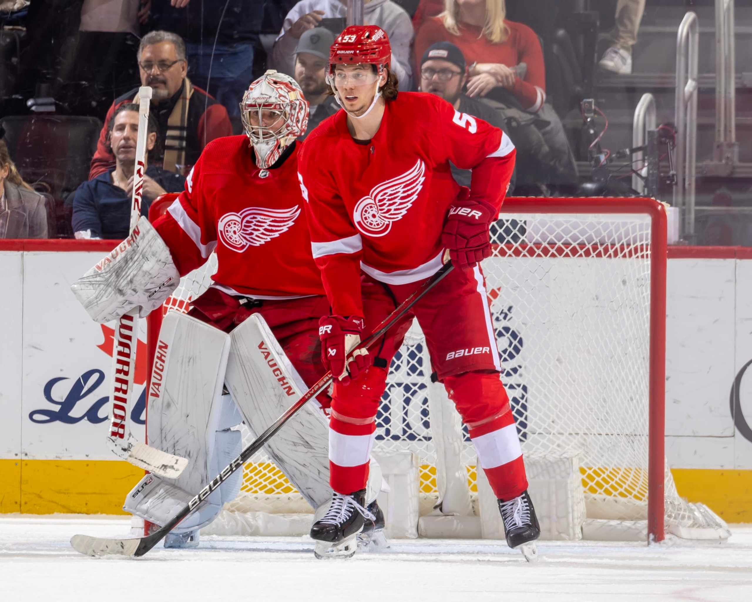 DETROIT, MI - JANUARY 13: Alex Lyon #34 and Moritz Seider #53 of the Detroit Red Wings follows the play against the Los Angeles Kings during third period at Little Caesars Arena. Detroit defeated Los Angeles 5-3. (Photo by Dave Reginek/NHLI via Getty Images)