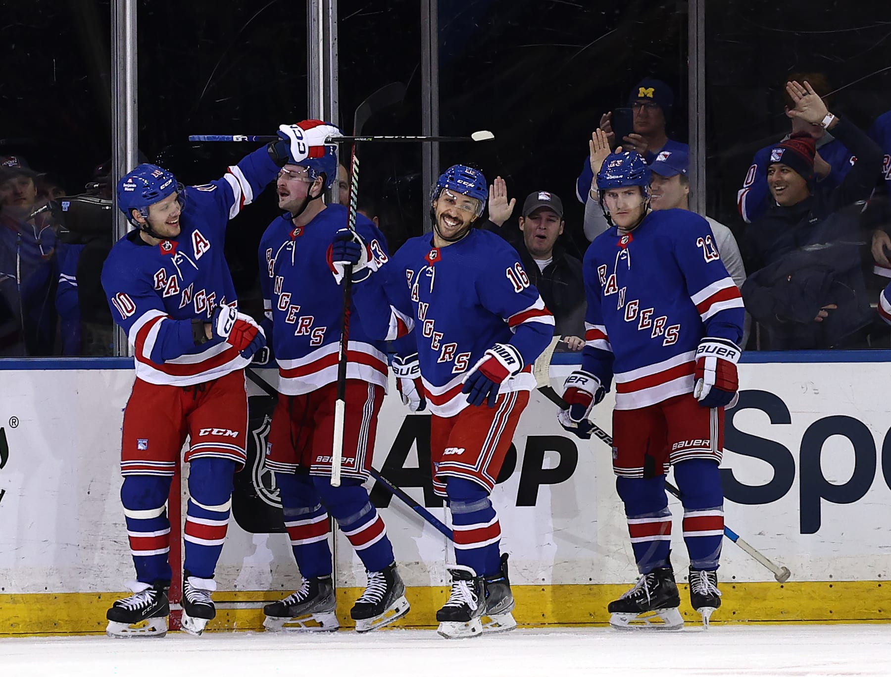 NEW YORK, NEW YORK - JANUARY 04: Artemi Panarin #10 of the New York Rangers is congratulated by teammates Alexis Lafreniere #13,Vincent Trocheck #16 and Adam Fox #23 of the New York Rangers after he scored a goal during the first period against the Chicago Blackhawks at Madison Square Garden on January 04, 2024 in New York City. (Photo by Elsa/Getty Images)