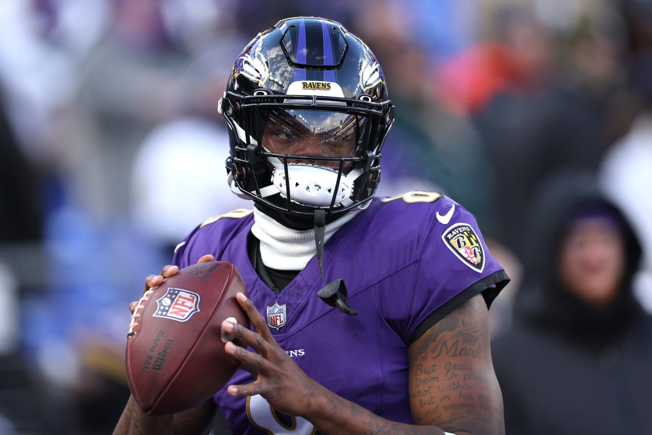 BALTIMORE, MARYLAND - JANUARY 20: Lamar Jackson #8 of the Baltimore Ravens warms up prior to the AFC Divisional Playoff game against the Houston Texans at M&T Bank Stadium on January 20, 2024 in Baltimore, Maryland. (Photo by Patrick Smith/Getty Images)