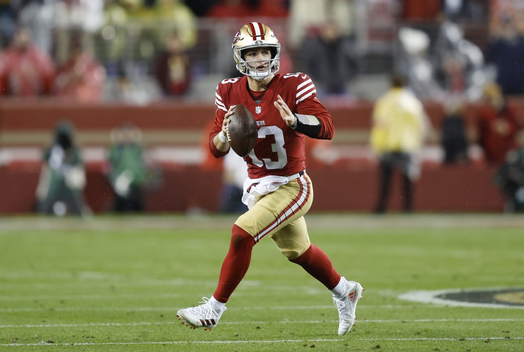 SANTA CLARA, CALIFORNIA - JANUARY 20: Brock Purdy #13 of the San Francisco 49ers looks to pass during the first half against the Green Bay Packers in the NFC Divisional Playoffs at Levi's Stadium on January 20, 2024 in Santa Clara, California. (Photo by Lachlan Cunningham/Getty Images)