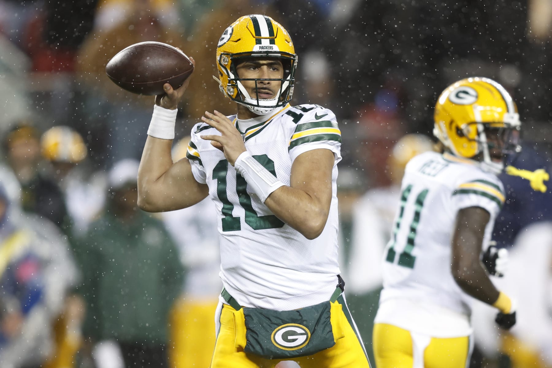 SANTA CLARA, CALIFORNIA - JANUARY 20: Jordan Love #10 of the Green Bay Packers looks to pass during the first quarter against the San Francisco 49ers in the NFC Divisional Playoffs at Levi's Stadium on January 20, 2024 in Santa Clara, California. (Photo by Lachlan Cunningham/Getty Images)