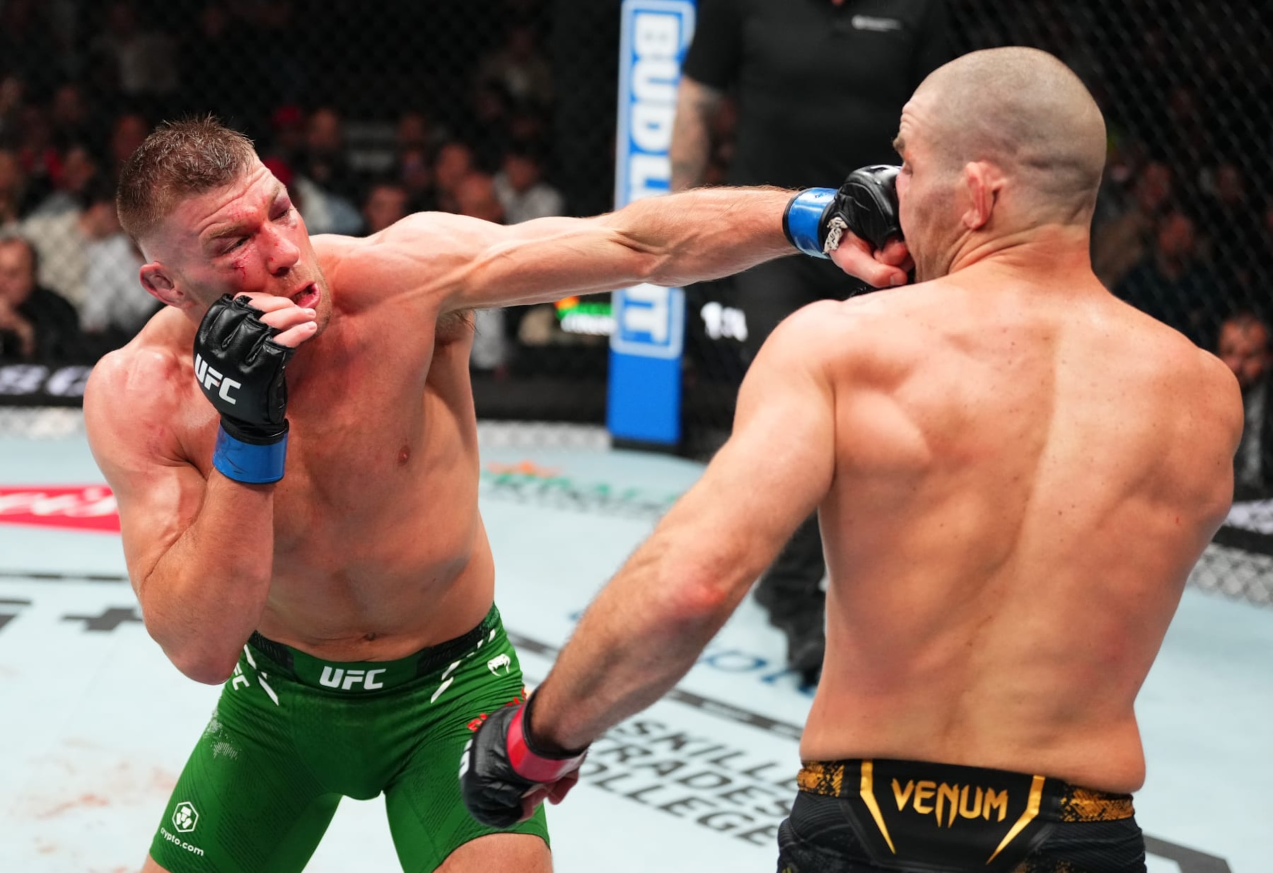 TORONTO, ONTARIO - JANUARY 20: (L-R) Dricus Du Plessis of South Africa punches Sean Strickland  in a UFC middleweight championship bout during the UFC 297 event at Scotiabank Arena on January 20, 2024 in Toronto, Ontario. (Photo by Jeff Bottari/Zuffa LLC via Getty Images)