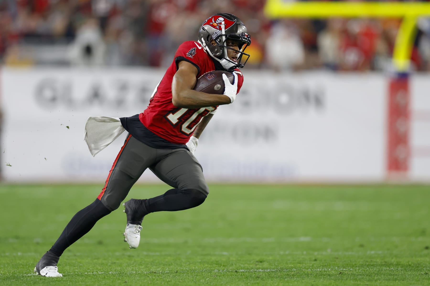 TAMPA, FLORIDA - JANUARY 15: Trey Palmer #10 of the Tampa Bay Buccaneers runs the ball to score a 56 yard touchdown against the Philadelphia Eagles during the third quarter in the NFC Wild Card Playoffs at Raymond James Stadium on January 15, 2024 in Tampa, Florida. (Photo by Mike Ehrmann/Getty Images)