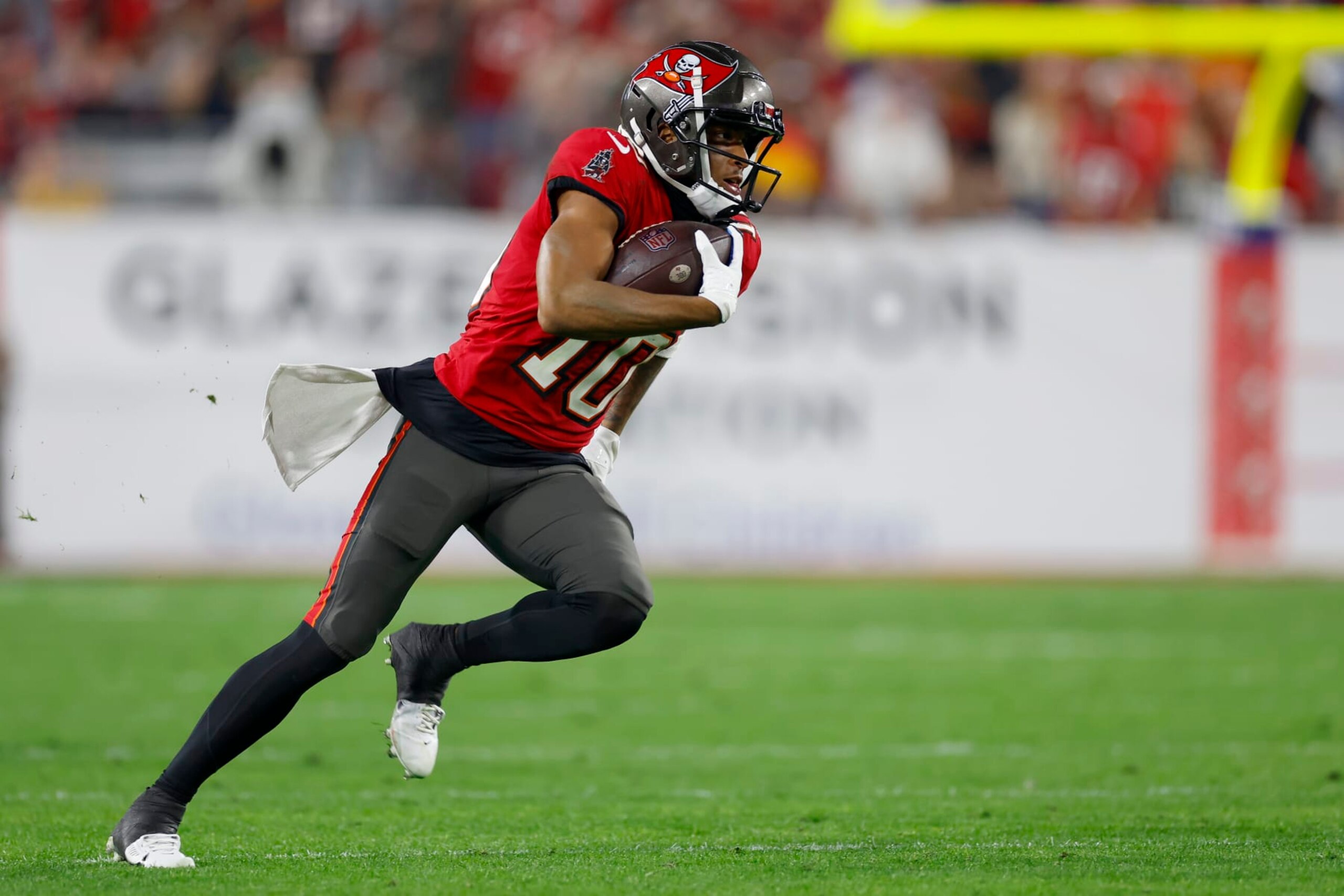 TAMPA, FLORIDA - JANUARY 15: Trey Palmer #10 of the Tampa Bay Buccaneers runs the ball to score a 56 yard touchdown against the Philadelphia Eagles during the third quarter in the NFC Wild Card Playoffs at Raymond James Stadium on January 15, 2024 in Tampa, Florida. (Photo by Mike Ehrmann/Getty Images)