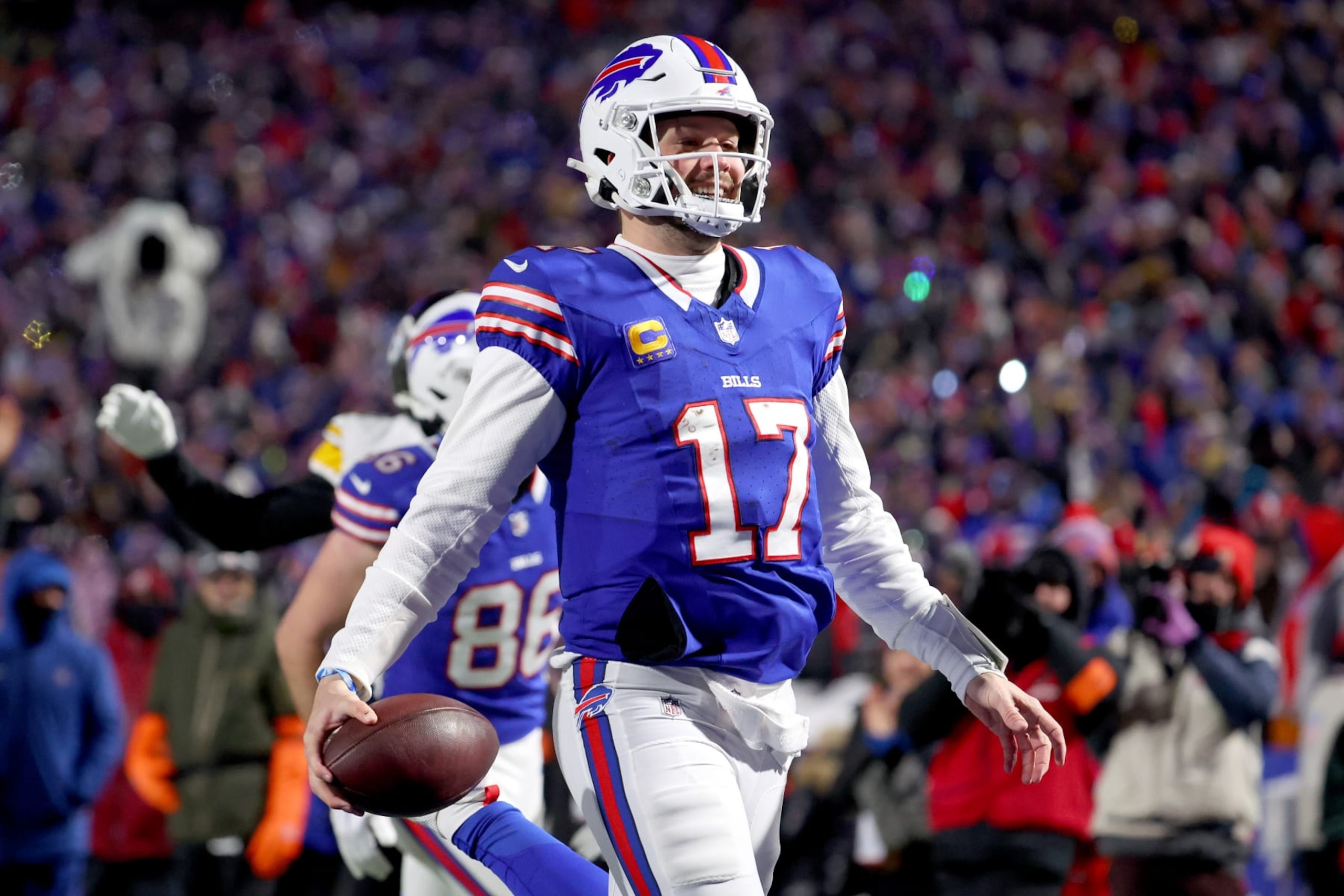 ORCHARD PARK, NEW YORK - JANUARY 15: Josh Allen #17 of the Buffalo Bills celebrates his 52-yard touchdown against the Pittsburgh Steelers during the second quarter at Highmark Stadium on January 15, 2024 in Orchard Park, New York. (Photo by Timothy T Ludwig/Getty Images)