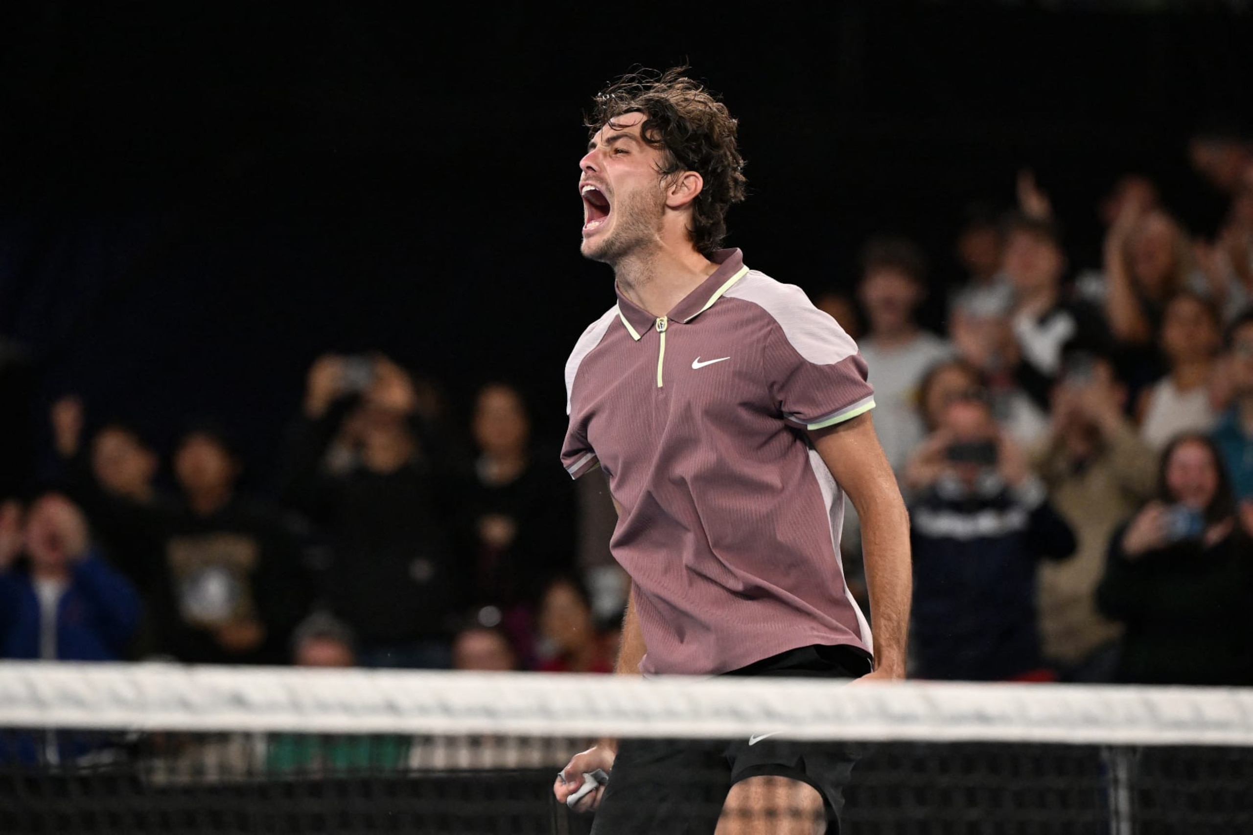 USA's Taylor Fritz celebrates victory against Greece's Stefanos Tsitsipas after their men's singles match on day eight of the Australian Open tennis tournament in Melbourne on January 21, 2024. (Photo by WILLIAM WEST / AFP) / -- IMAGE RESTRICTED TO EDITORIAL USE - STRICTLY NO COMMERCIAL USE -- (Photo by WILLIAM WEST/AFP via Getty Images)