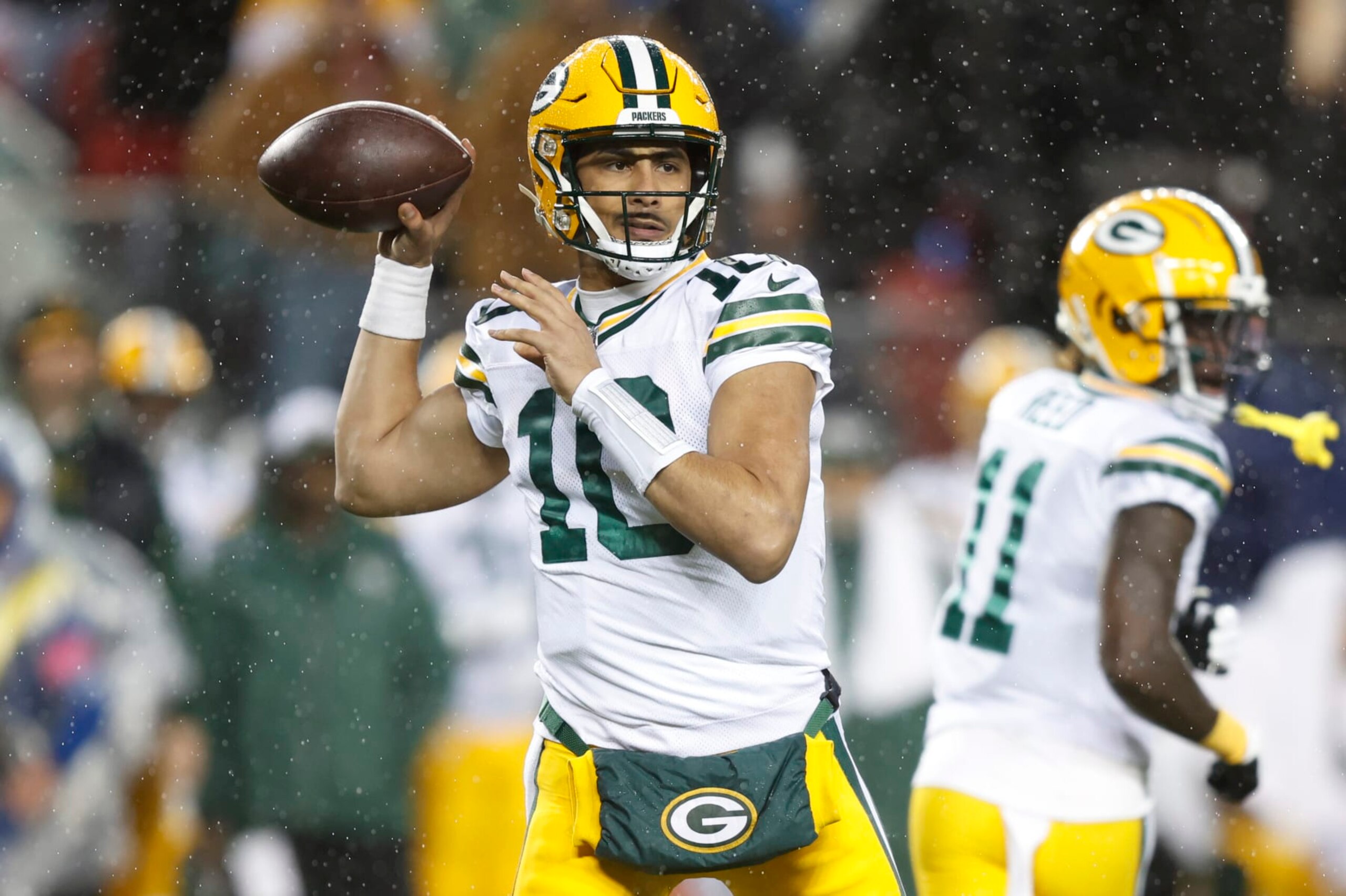 SANTA CLARA, CALIFORNIA - JANUARY 20: Jordan Love #10 of the Green Bay Packers looks to pass during the first quarter against the San Francisco 49ers in the NFC Divisional Playoffs at Levi's Stadium on January 20, 2024 in Santa Clara, California. (Photo by Lachlan Cunningham/Getty Images)