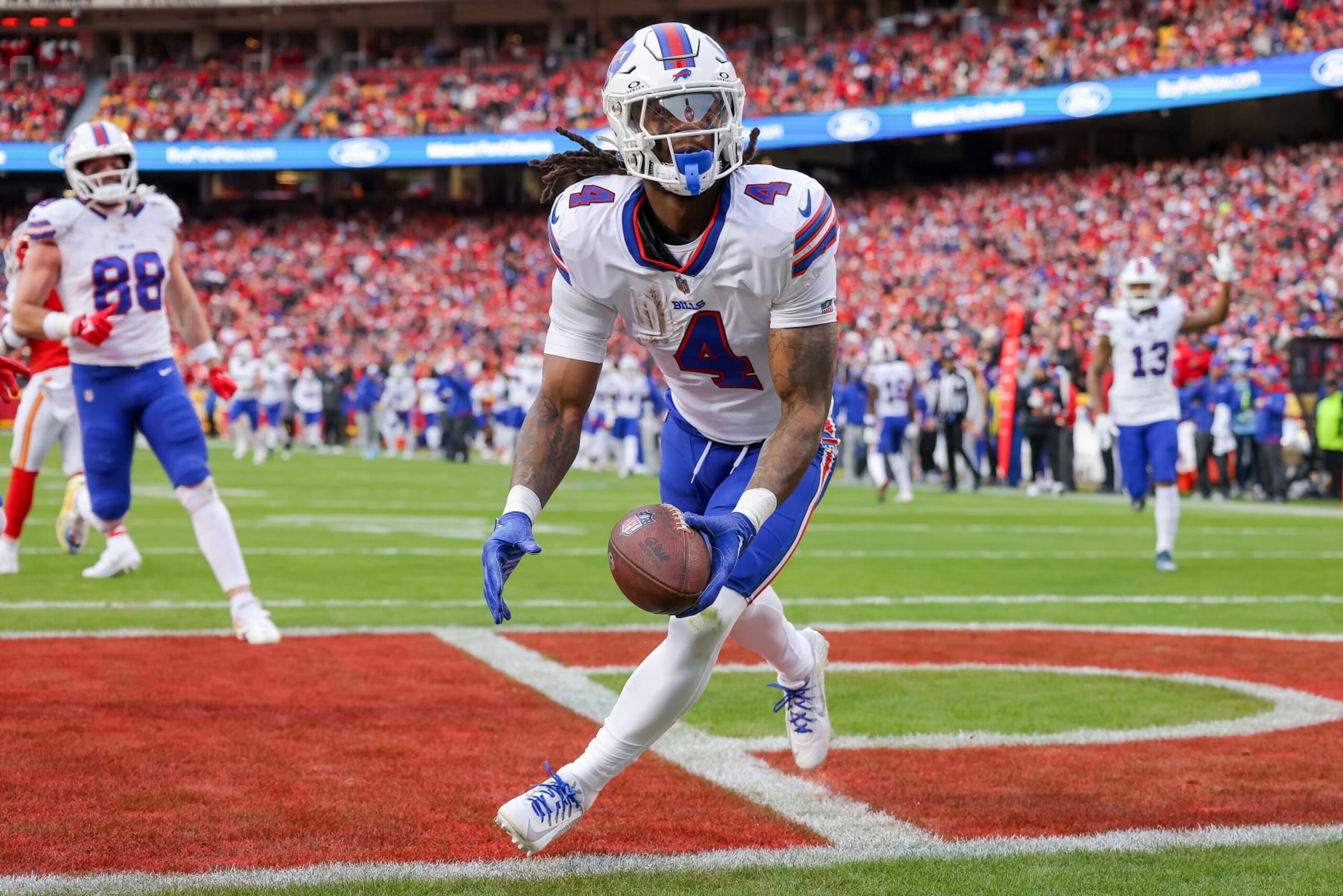KANSAS CITY, MISSOURI - DECEMBER 10: James Cook #4 of the Buffalo Bills reacts after scoring a touchdown during the first half of the game against the Kansas City Chiefs at GEHA Field at Arrowhead Stadium on December 10, 2023 in Kansas City, Missouri. (Photo by Jamie Squire/Getty Images)