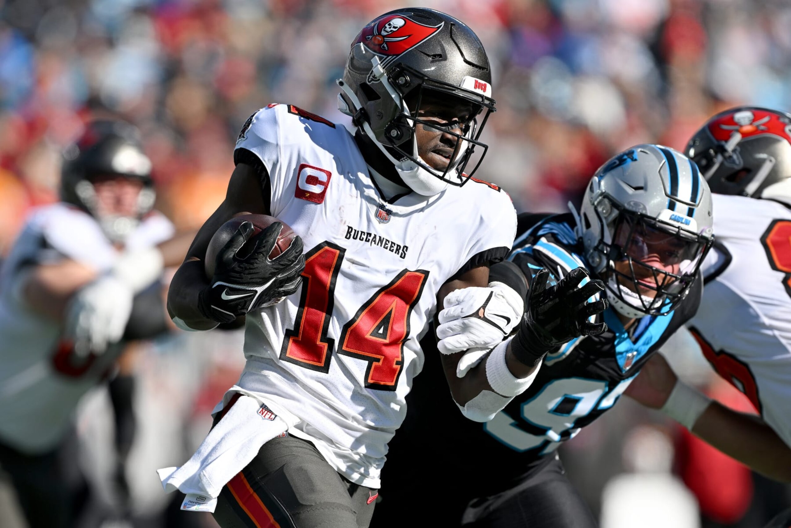 CHARLOTTE, NORTH CAROLINA - JANUARY 07: Chris Godwin #14 of the Tampa Bay Buccaneers runs with the ball during the first quarter against the Carolina Panthers at Bank of America Stadium on January 07, 2024 in Charlotte, North Carolina. (Photo by Grant Halverson/Getty Images)