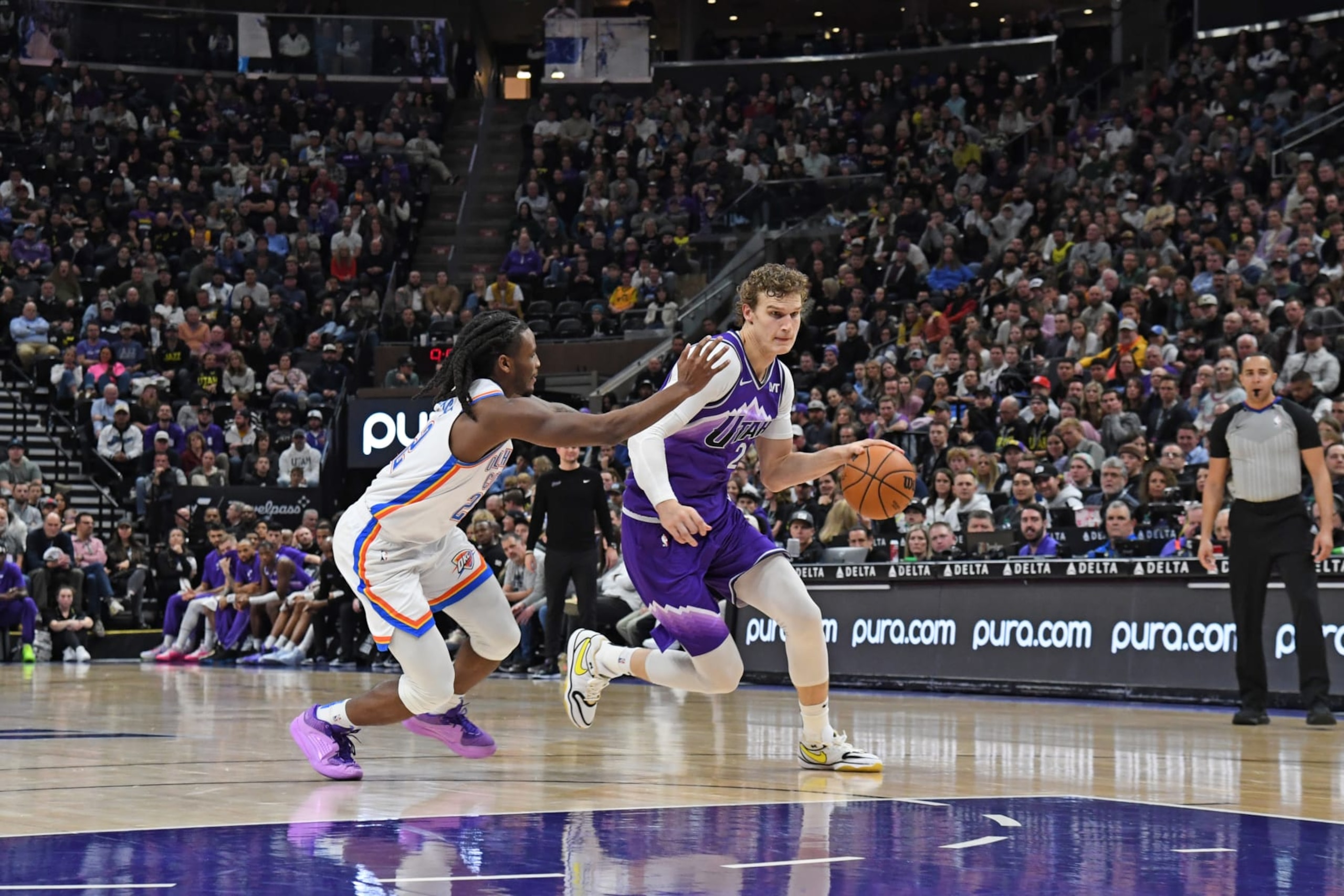 SALT LAKE CITY, UT - JANUARY 18: Lauri Markkanen #23 of the Utah Jazz dribbles the ball during the game against the Oklahoma City Thunder on January 18, 2024 at vivint.SmartHome Arena in Salt Lake City, Utah. NOTE TO USER: User expressly acknowledges and agrees that, by downloading and or using this Photograph, User is consenting to the terms and conditions of the Getty Images License Agreement. Mandatory Copyright Notice: Copyright 2024 NBAE (Photo by Noah Graham/NBAE via Getty Images) SALT LAKE CITY, UT - JANUARY 18: Lauri Markkanen #23 of the Utah Jazz dribbles the ball during the game against the Oklahoma City Thunder on January 18, 2024 at vivint.SmartHome Arena in Salt Lake City, Utah. NOTE TO USER: User expressly acknowledges and agrees that, by downloading and or using this Photograph, User is consenting to the terms and conditions of the Getty Images License Agreement. Mandatory Copyright Notice: Copyright 2024 NBAE (Photo by Noah Graham/NBAE via Getty Images)