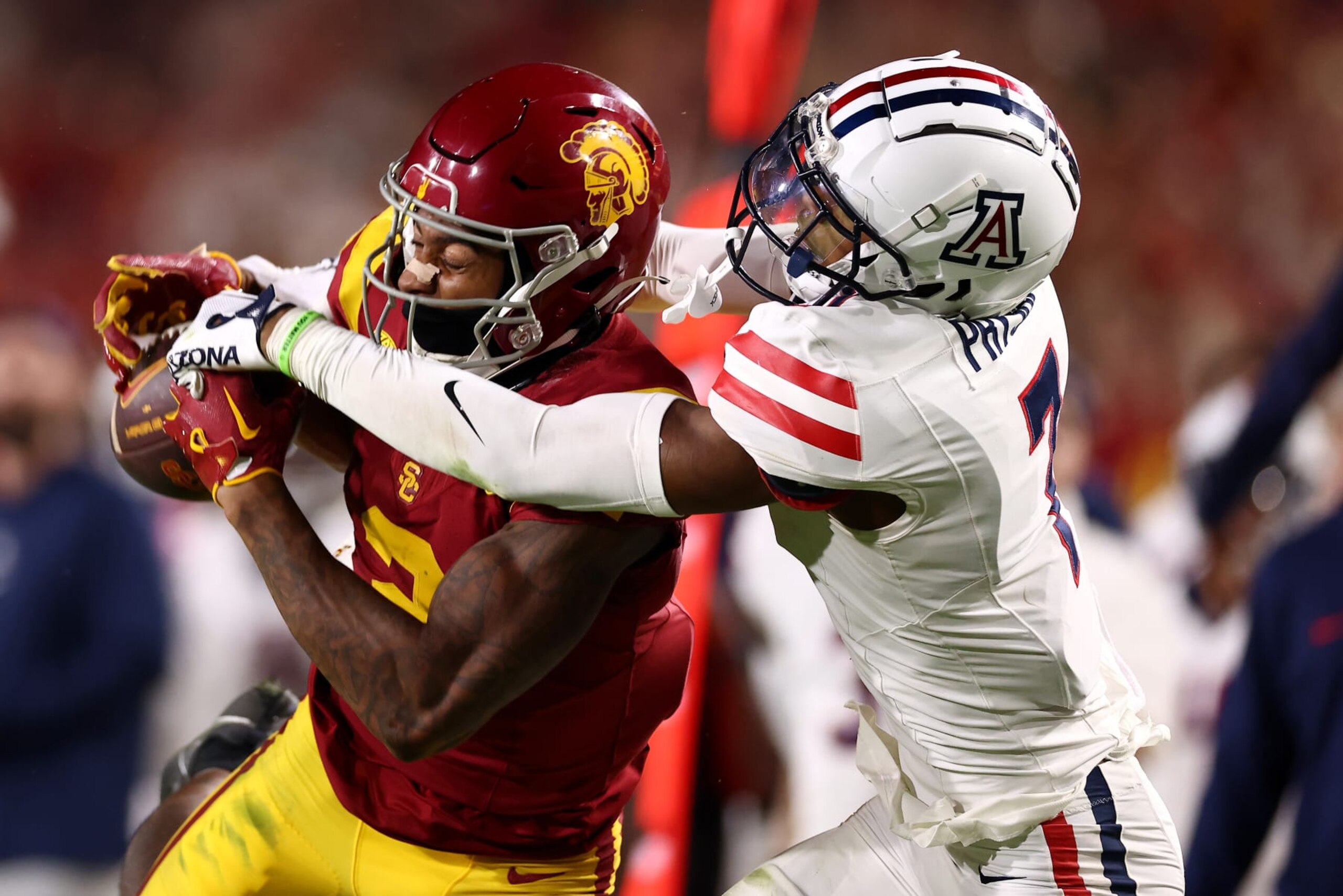 LOS ANGELES, CALIFORNIA - OCTOBER 07: Brenden Rice #2 of the USC Trojans makes a catch against Ephesians Prysock #7 of the Arizona Wildcats during the second quarter at United Airlines Field at the Los Angeles Memorial Coliseum on October 07, 2023 in Los Angeles, California. (Photo by Katelyn Mulcahy/Getty Images)