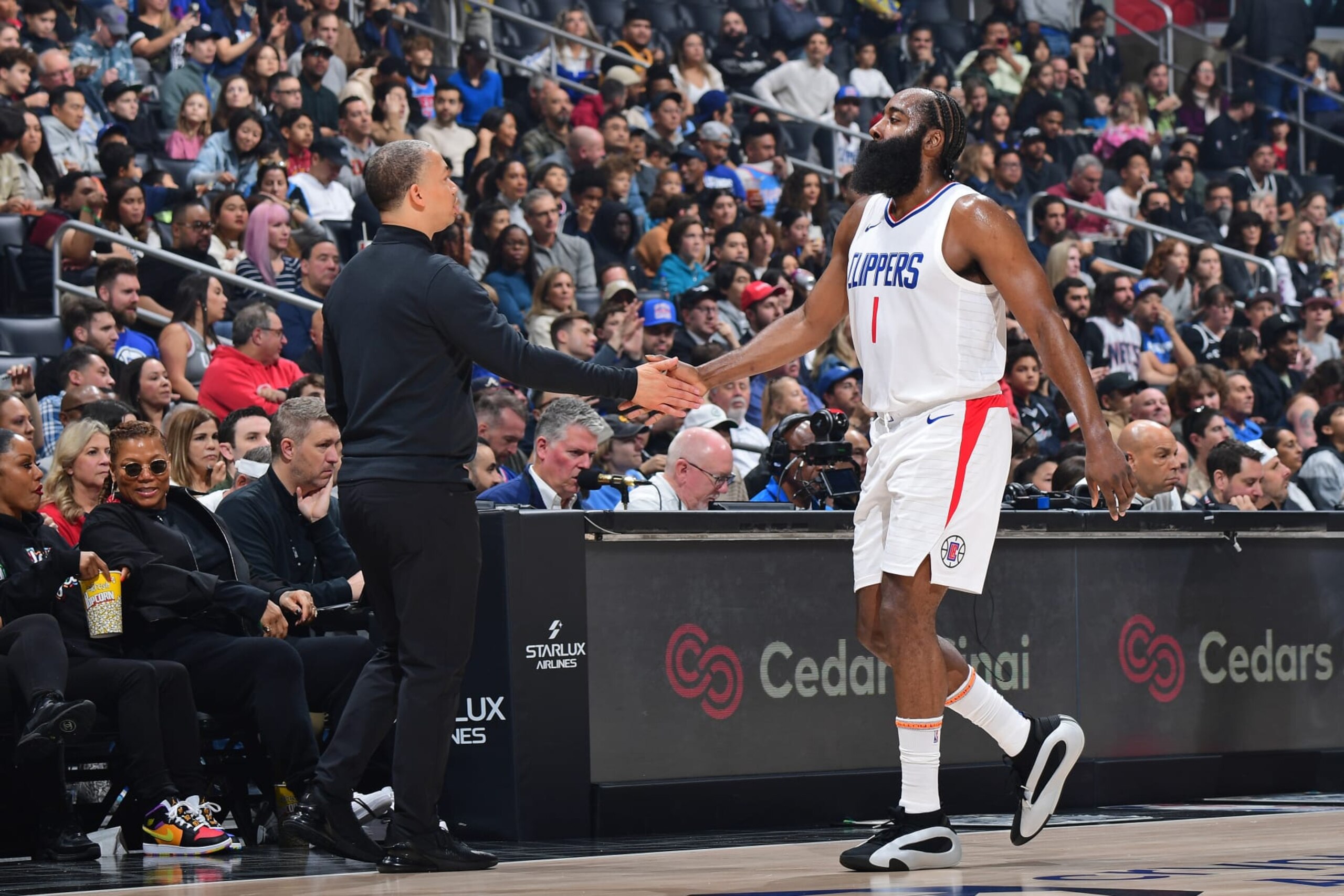 LOS ANGELES, CA - JANUARY 21: James Harden #1 and Head Coach Tyronn Lue of the LA Clippers high five during the game against the Brooklyn Nets on January 21, 2024 at Crypto.Com Arena in Los Angeles, California. NOTE TO USER: User expressly acknowledges and agrees that, by downloading and/or using this Photograph, user is consenting to the terms and conditions of the Getty Images License Agreement. Mandatory Copyright Notice: Copyright 2024 NBAE (Photo by Adam Pantozzi/NBAE via Getty Images)