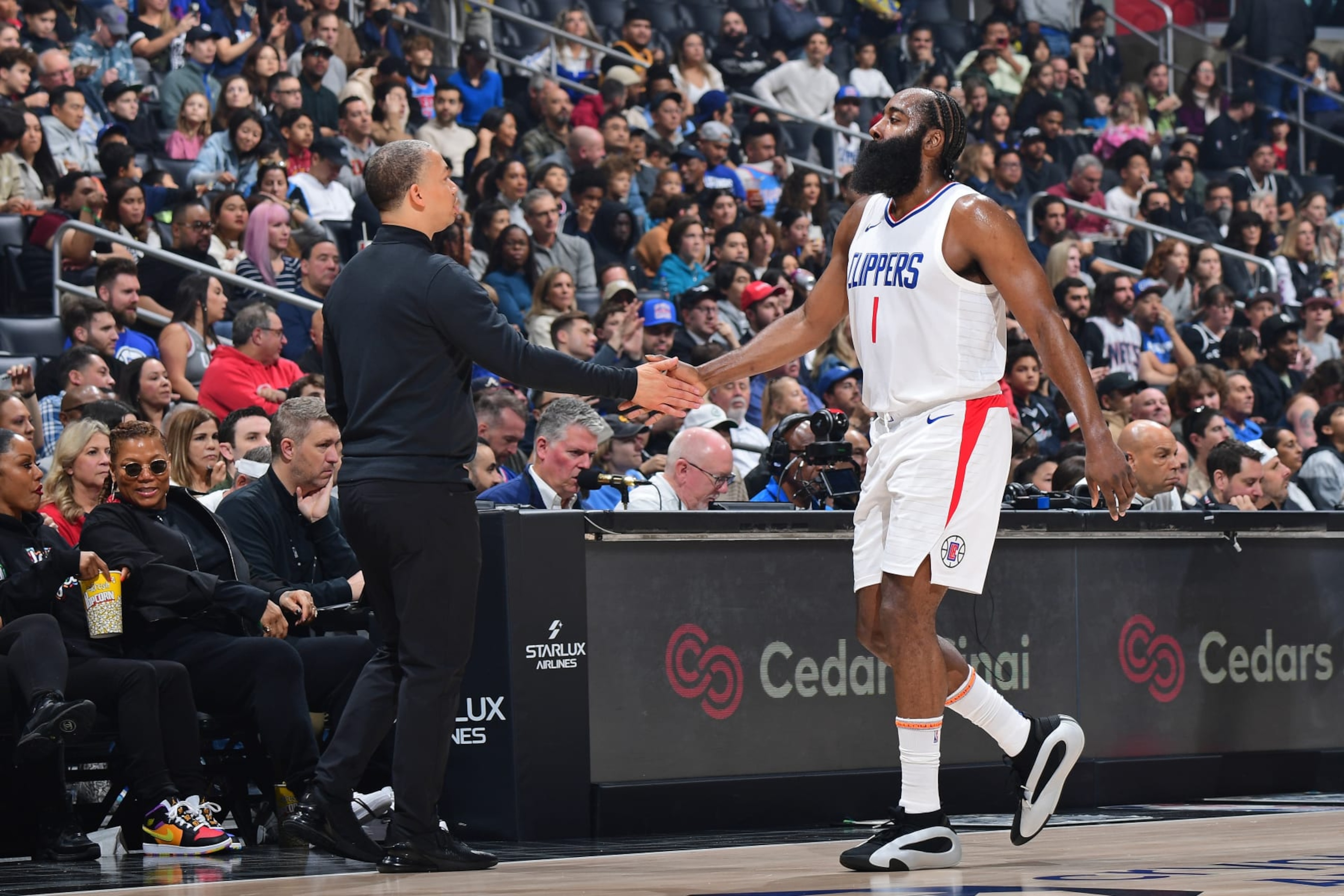 LOS ANGELES, CA - JANUARY 21: James Harden #1 and Head Coach Tyronn Lue of the LA Clippers high five during the game against the Brooklyn Nets on January 21, 2024 at Crypto.Com Arena in Los Angeles, California. NOTE TO USER: User expressly acknowledges and agrees that, by downloading and/or using this Photograph, user is consenting to the terms and conditions of the Getty Images License Agreement. Mandatory Copyright Notice: Copyright 2024 NBAE (Photo by Adam Pantozzi/NBAE via Getty Images)