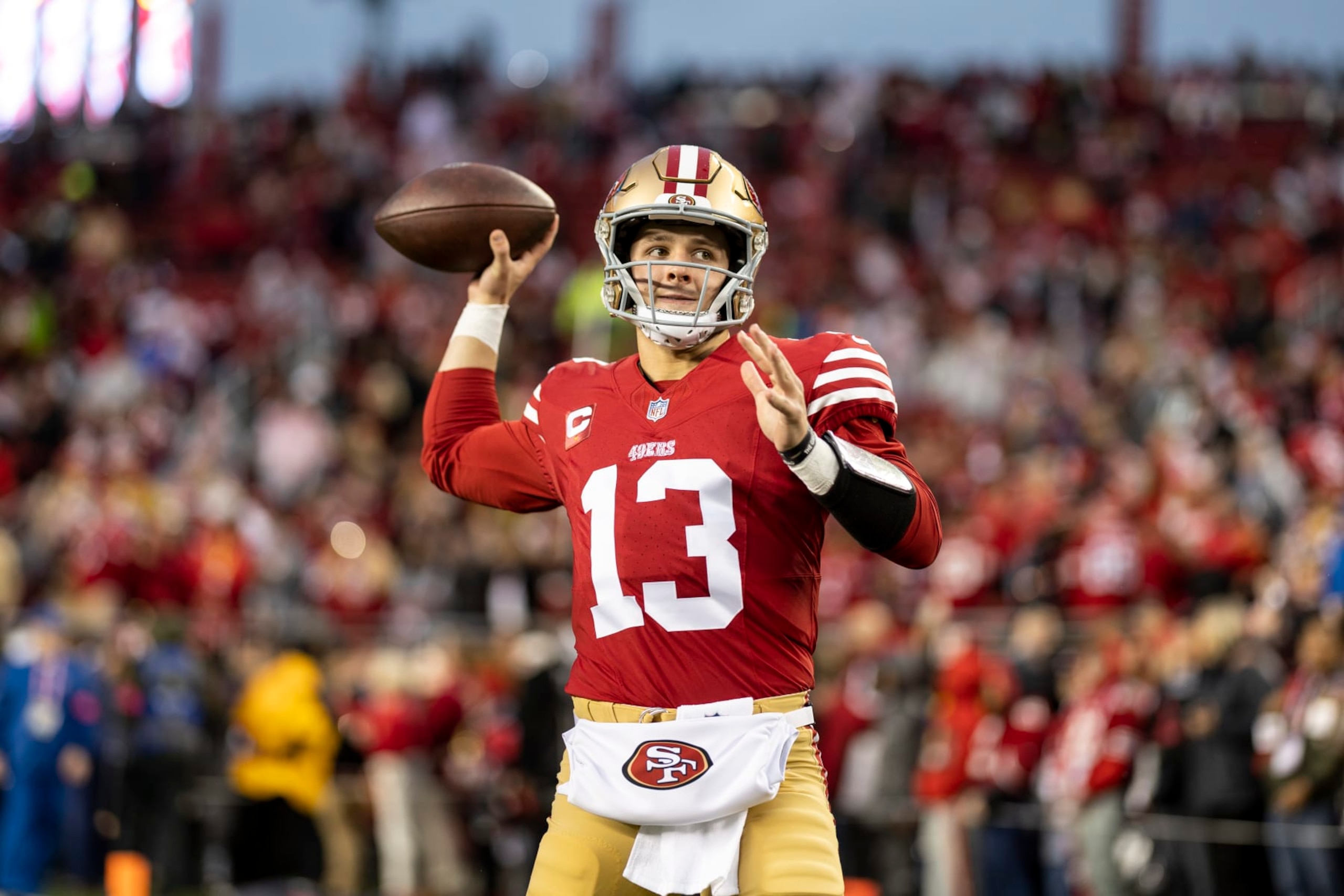 SANTA CLARA, CALIFORNIA - JANUARY 20: Brock Purdy #13 of the San Francisco 49ers looks to pass as he warms up prior to an NFL divisional round playoff football game between the San Francisco 49ers and the Green Bay Packers at Levi's Stadium on January 20, 2024 in Santa Clara, California. (Photo by Michael Owens/Getty Images)