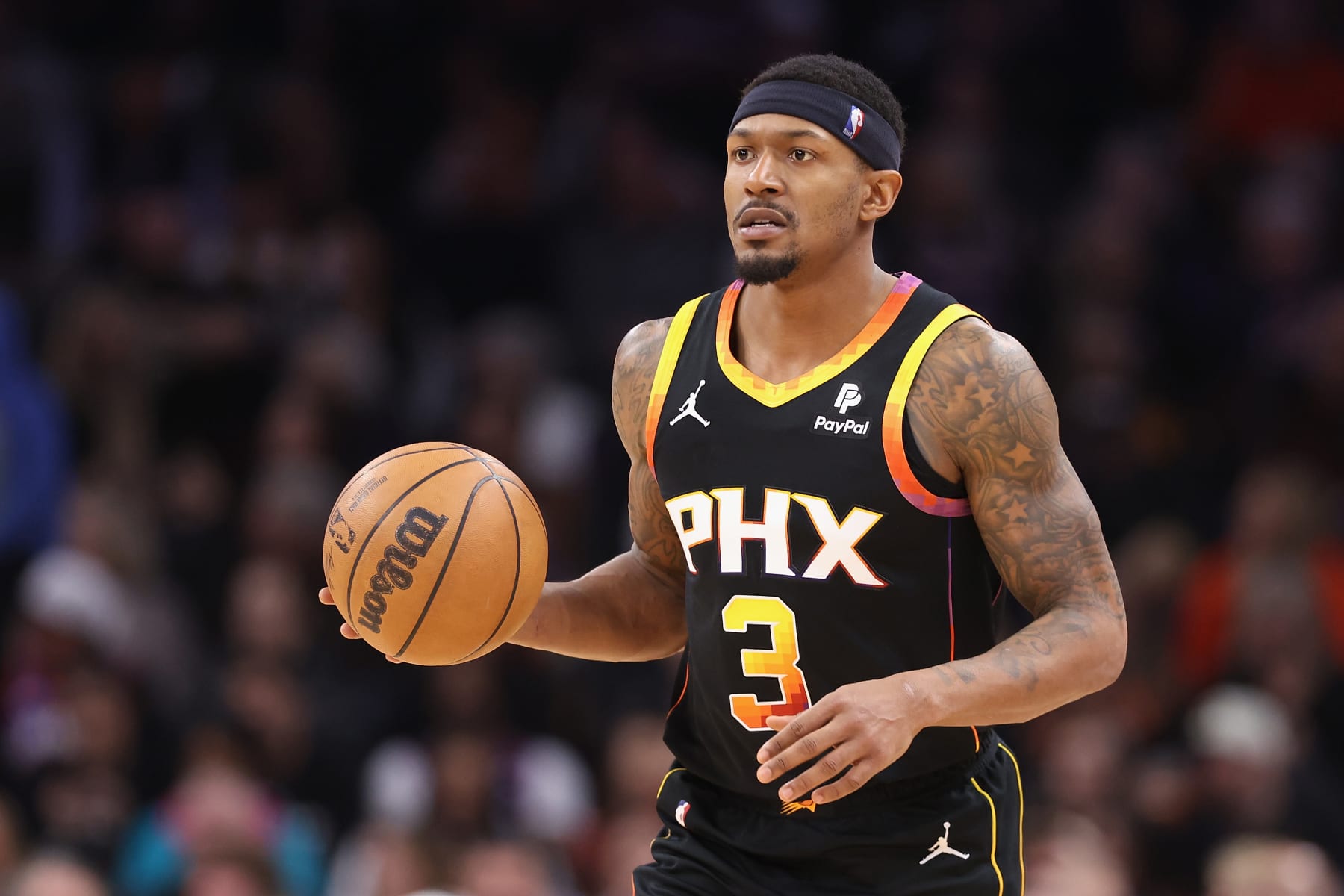 PHOENIX, ARIZONA - JANUARY 16: Bradley Beal #3 of the Phoenix Suns handles the ball during the second half of the NBA game at Footprint Center on January 16, 2024 in Phoenix, Arizona. The Suns defeated the Kings 119-117. NOTE TO USER: User expressly acknowledges and agrees that, by downloading and or using this photograph, User is consenting to the terms and conditions of the Getty Images License Agreement.  (Photo by Christian Petersen/Getty Images)