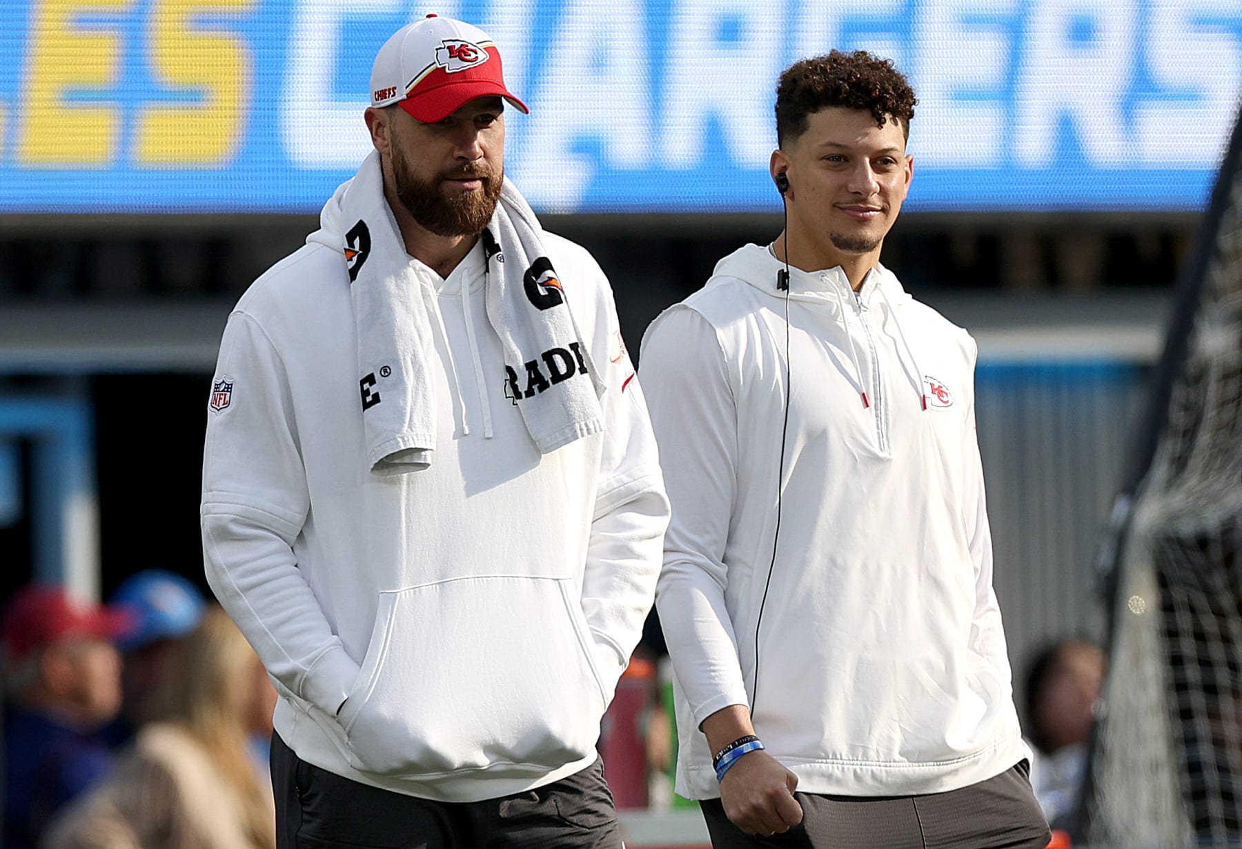 INGLEWOOD, CALIFORNIA - JANUARY 07: Travis Kelce #87 of the Kansas City Chiefs and Patrick Mahomes #15 of the Kansas City Chiefs look on from the sidelines during a game against the Los Angeles Chargers at SoFi Stadium on January 07, 2024 in Inglewood, California. (Photo by Harry How/Getty Images)
