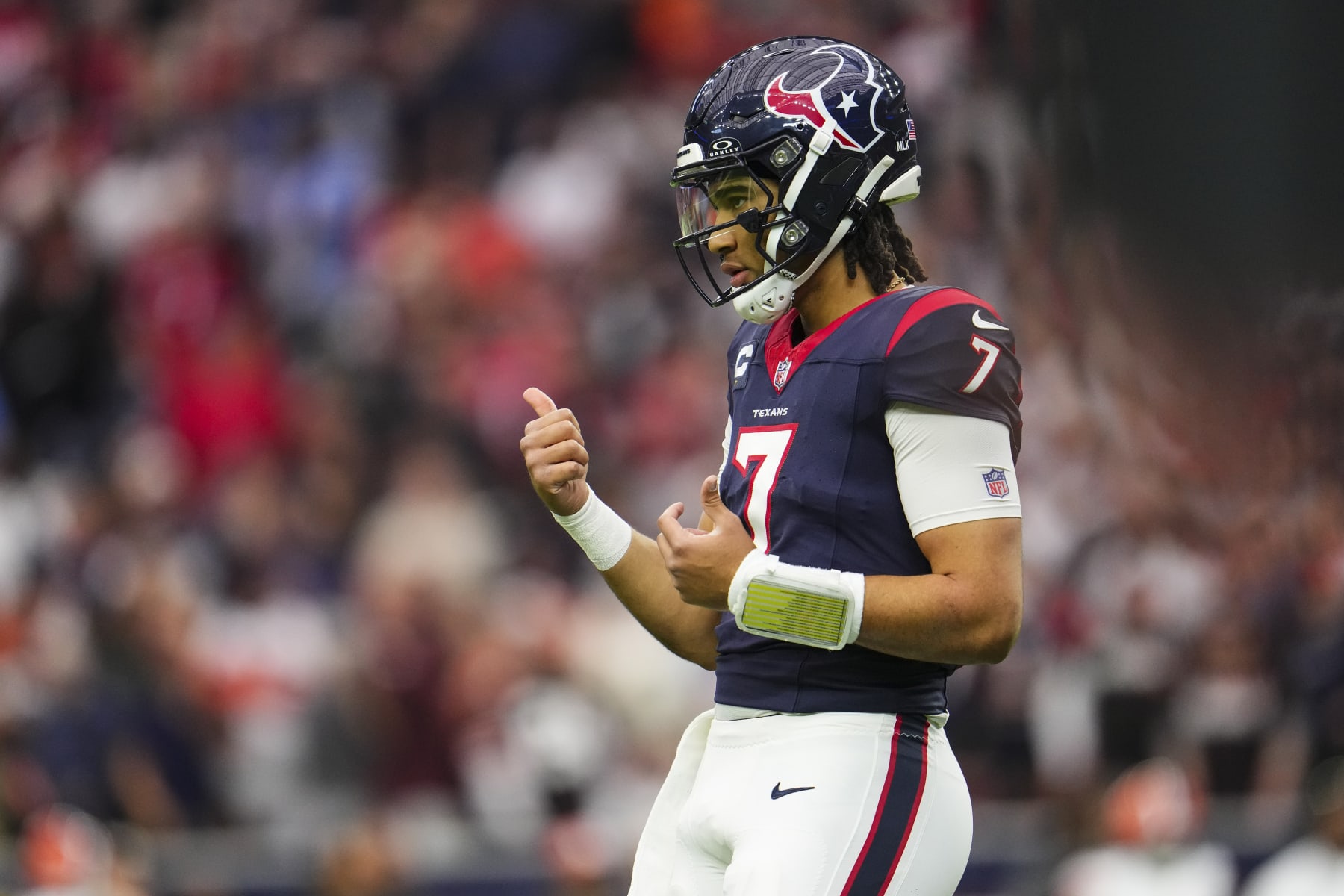 HOUSTON, TX - JANUARY 13: C.J. Stroud #7 of the Houston Texans looks on from the field during an NFL wild-card playoff football game against the Cleveland Browns at NRG Stadium on January 13, 2024 in Houston, Texas. (Photo by Cooper Neill/Getty Images)